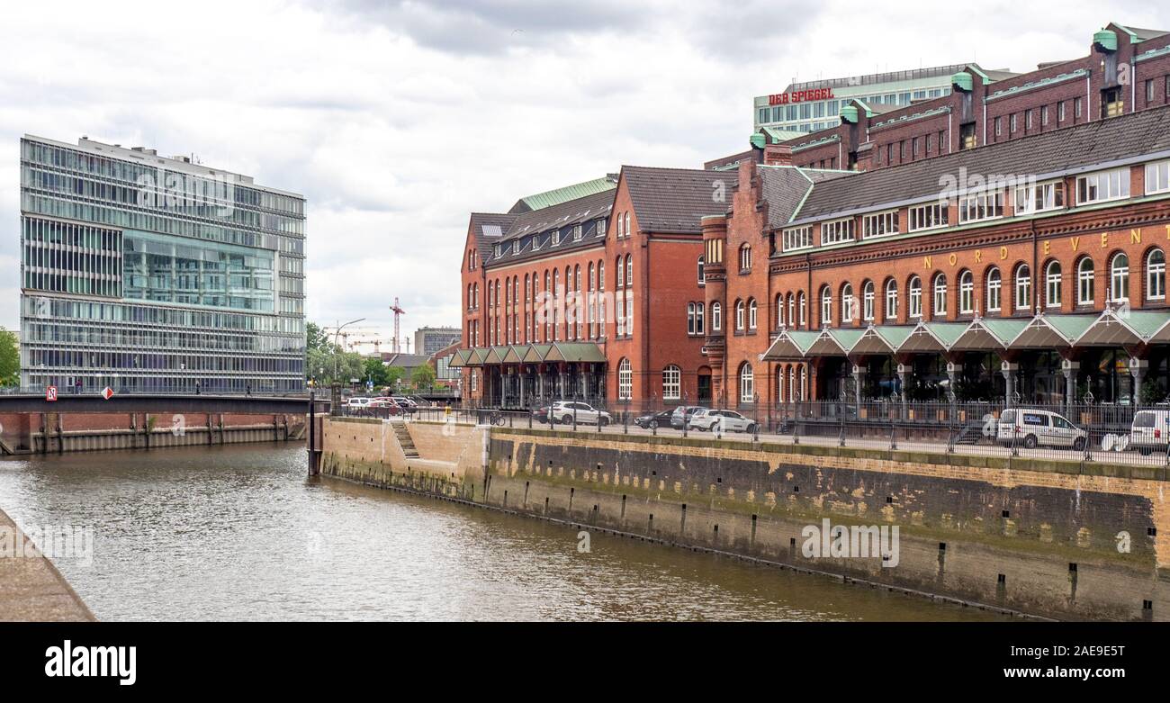 New office building and Former Main Customs Office on either side of Zoll Canal in Speicherstadt Warehouse District Altstadt Hamburg Germany Stock Photo