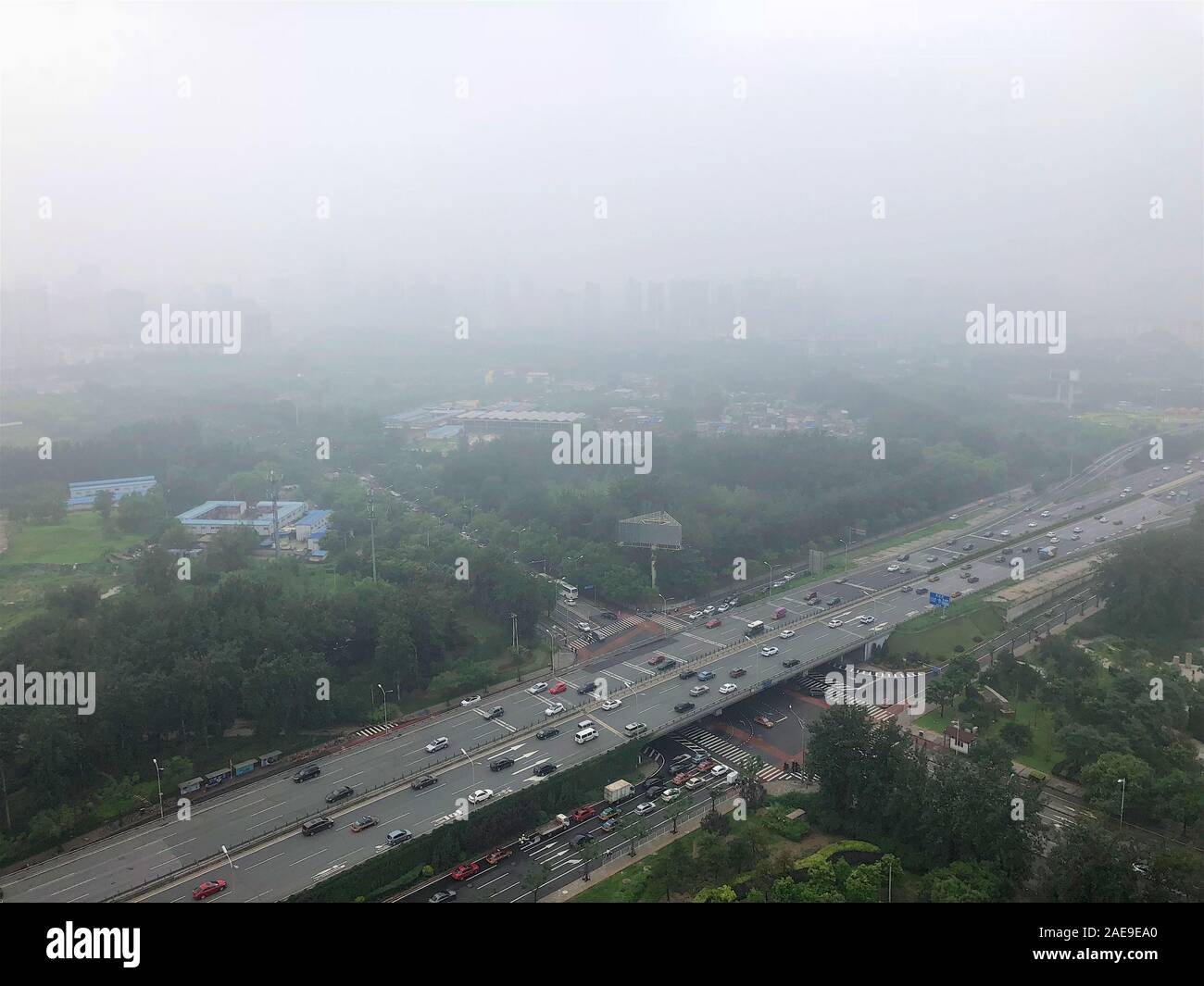 Top view highway with severe air pollution, fog and haze in Beijing city, China. Air pollution is a serious problem in Beijing, China, 2018, July 10 Stock Photo