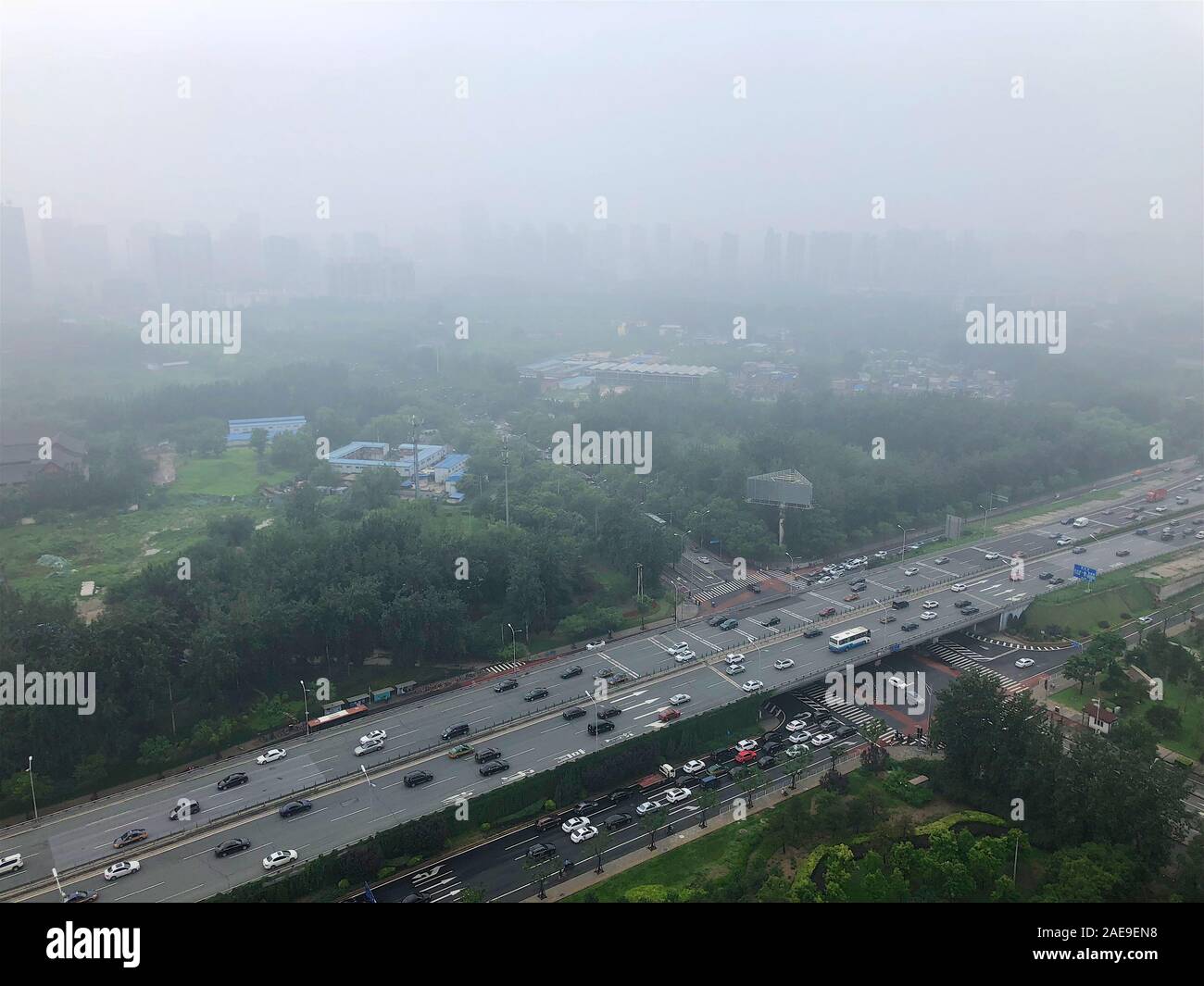 Top view highway with severe air pollution, fog and haze in Beijing city, China. Air pollution is a serious problem in Beijing, China, 2018, July 10 Stock Photo