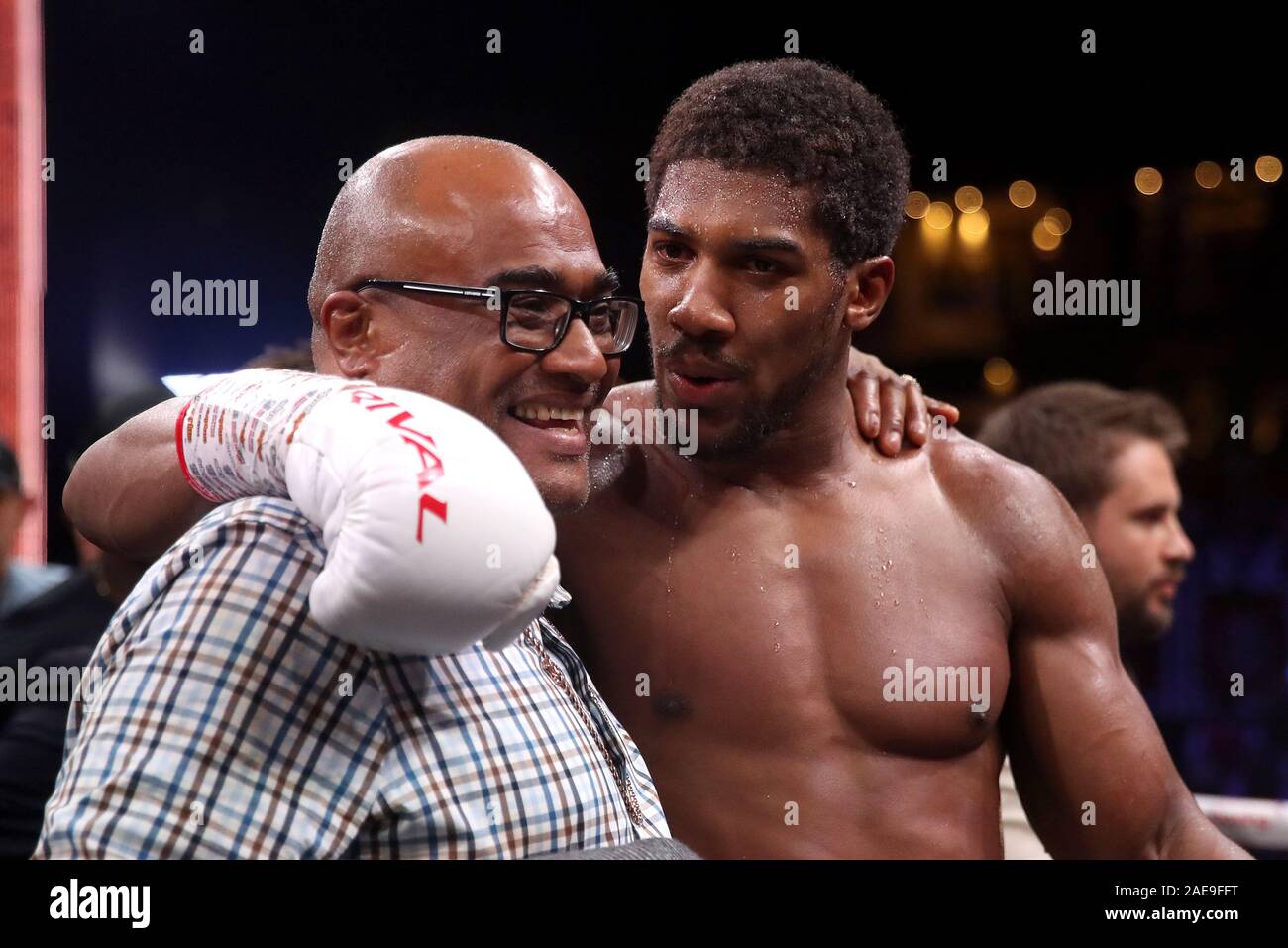 Anthony Joshua with his father Robert Joshua after reclaiming the IBF