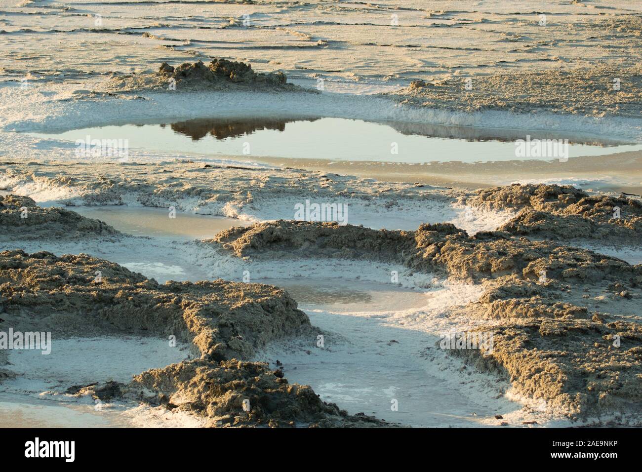 Pool of water in salt pan, with reflection, in Alviso, San Jose, California.  wildlife refuge where marshlands are being restored & returned to nature Stock Photo