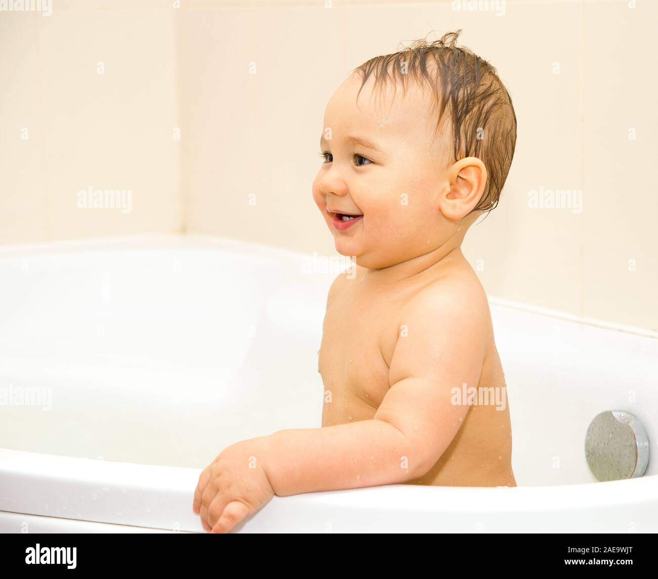 baby boy swimming in a bathroom Stock Photo Alamy