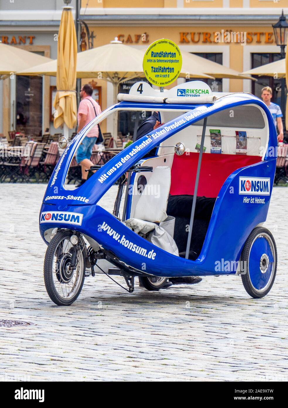 Konsum tricycle taxi in Platz Neumarkt Newmarket Altstadt Dresden Saxony Germany. Stock Photo