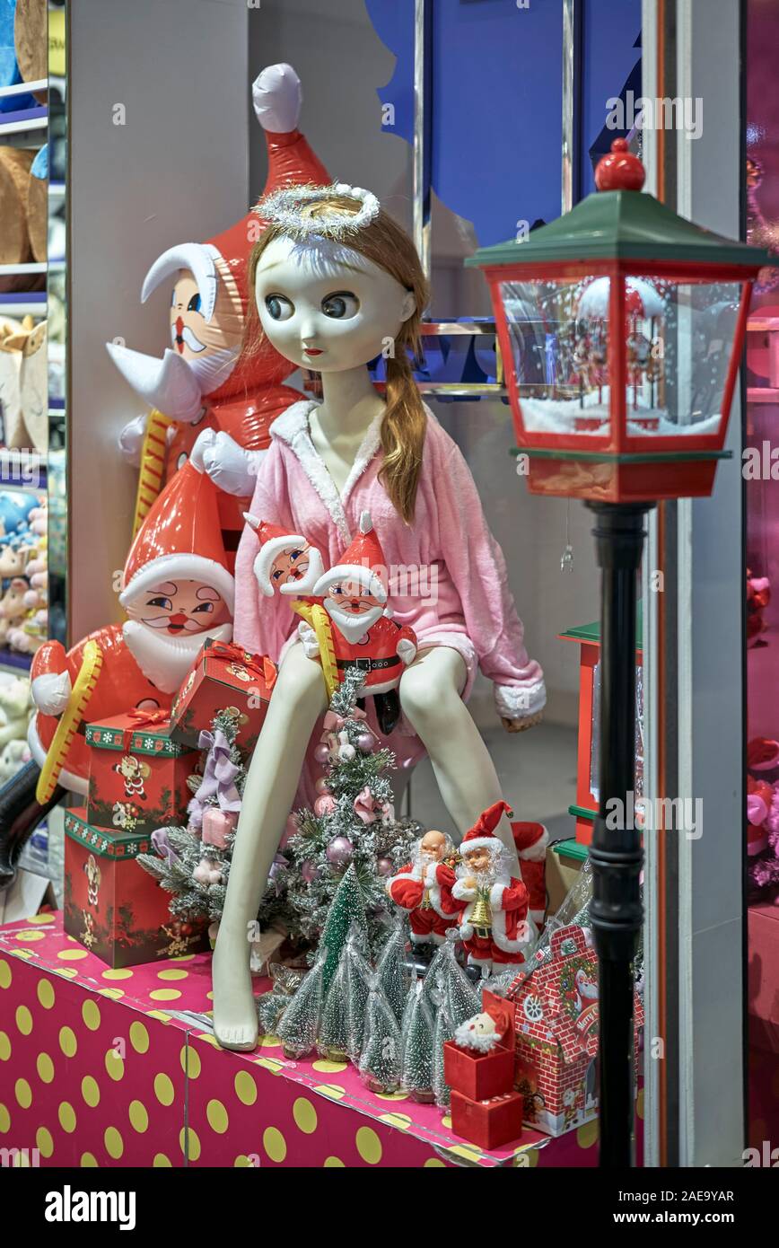 Christmas shop with festive Xmas Dolls Stock Photo