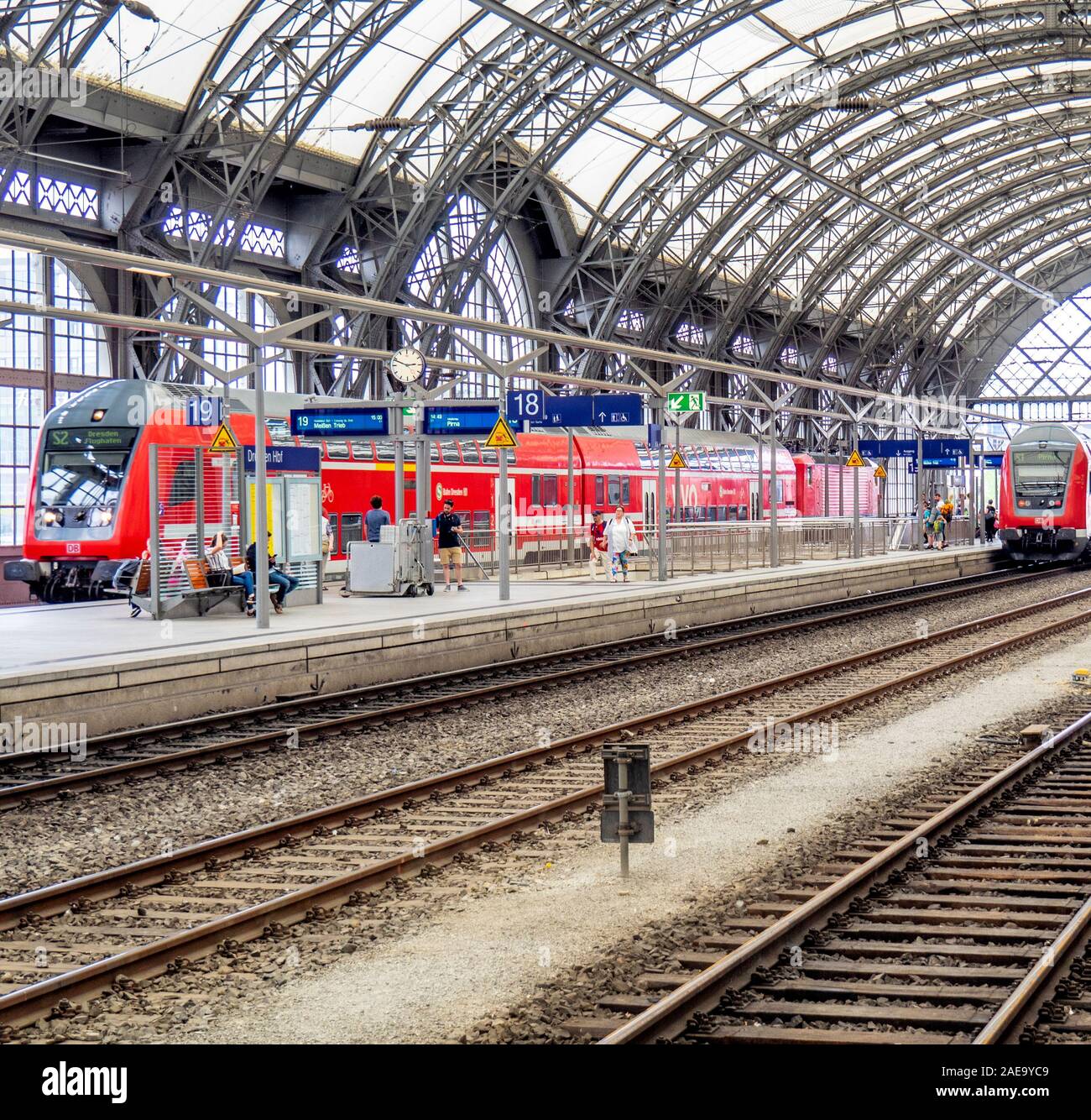 Dresden Hauptbahnhof HBF double decker passenger carriage rolling stock in train station with arched roof Dresden Saxony Germany. Stock Photo