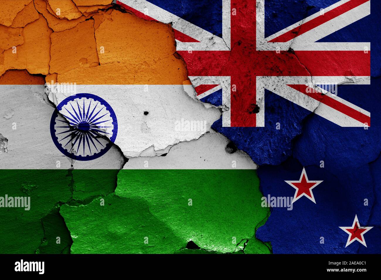 flags of India and New Zealand painted on cracked wall Stock Photo