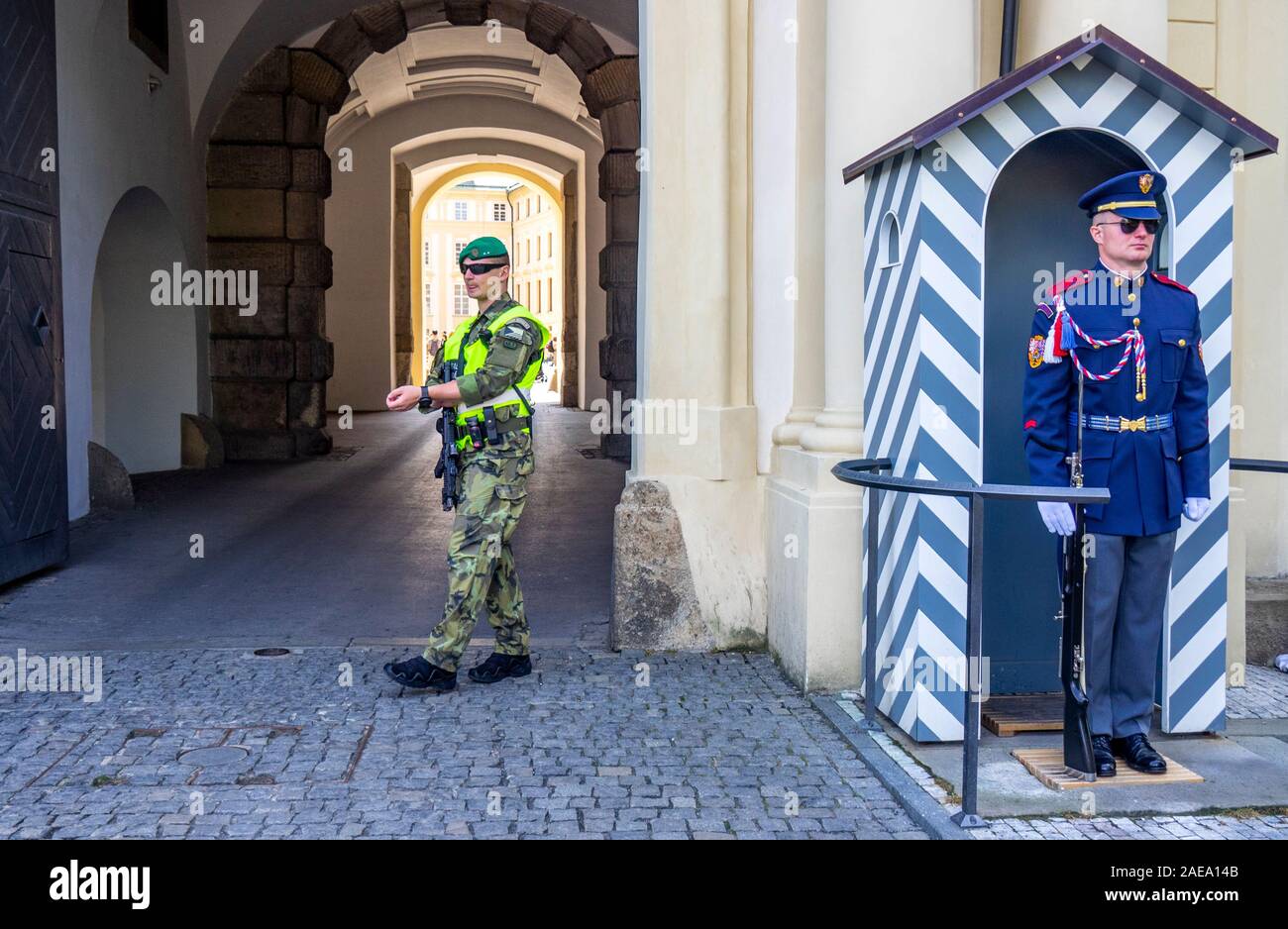 Prague Castle Guard and infantryman in front of sentry box at Imperial Stables entrance to Prague Castle complex Prague Czech Republic. Stock Photo