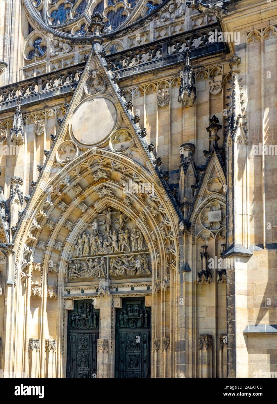Detail of sandstone carvings and sculptures above central portal of Gothic St Vitus Cathedral Prague Castle Complex Prague Czech Republic. Stock Photo