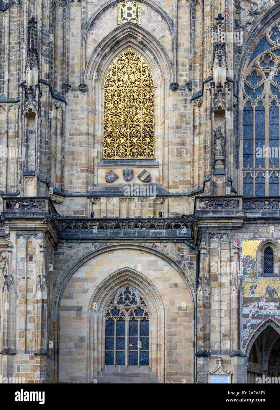 Gold gilding at base of Great South Tower of Gothic St Vitus Cathedral at Prague Castle Complex Prague Czech Republic. Stock Photo