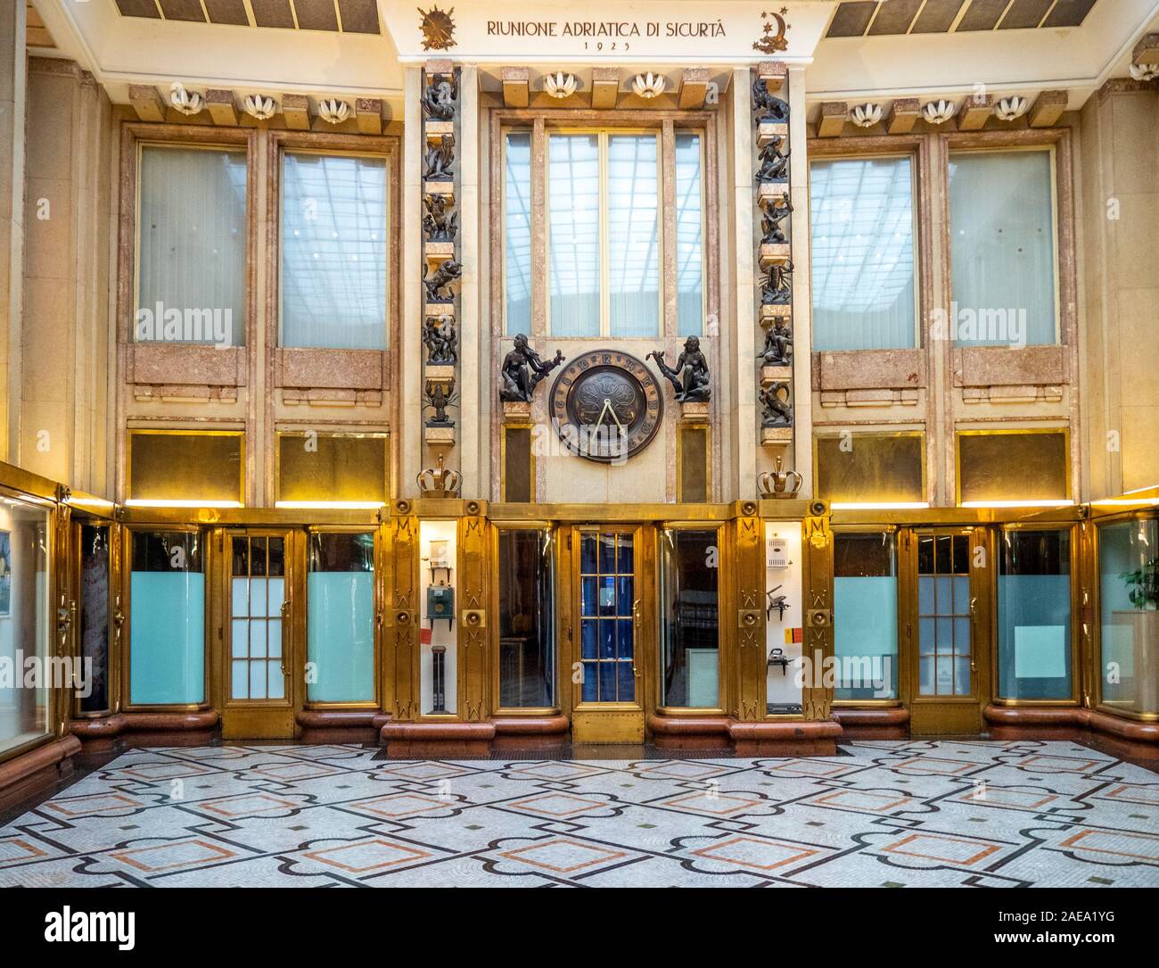 Decorative and ornate Art Deco style bronze statuettes and 24 hour clock  in foyer of Adria Passage Adria Palace New Town Prague Czech Republic. Stock Photo