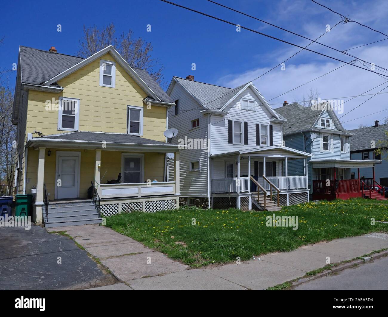 Street of detached working class houses with front yards. Stock Photo