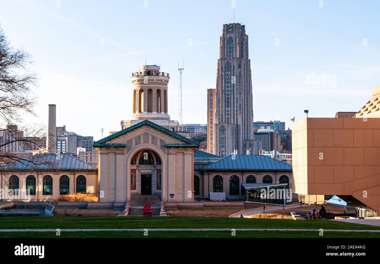 The Electrical and Computer Engineering building on the campus of Carnegie Mellon University with the Cathedral of Learning from the U of Pittsburgh Stock Photo