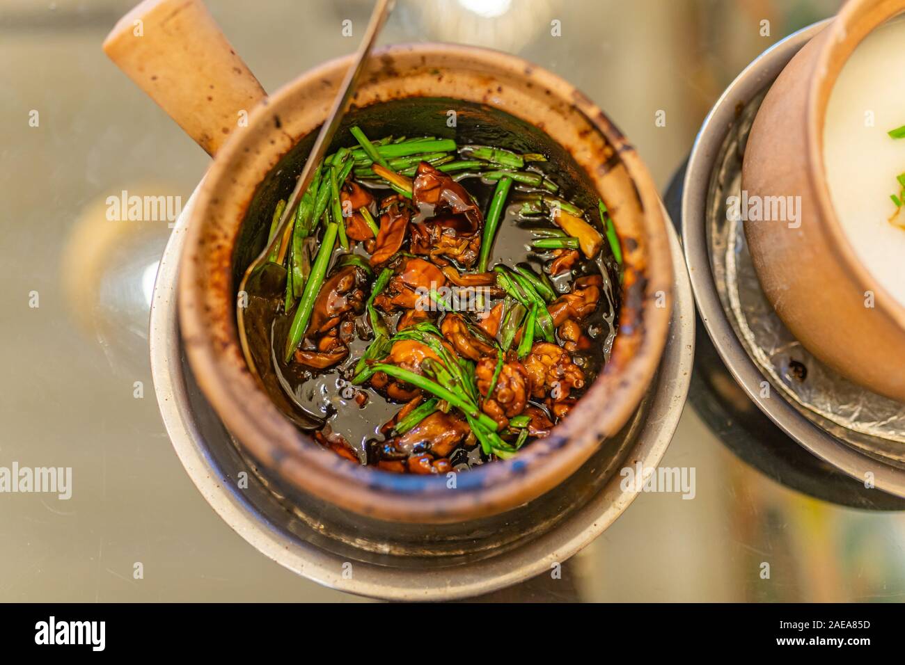 Singapore style braised frog and green onion porridge  Stock Photo