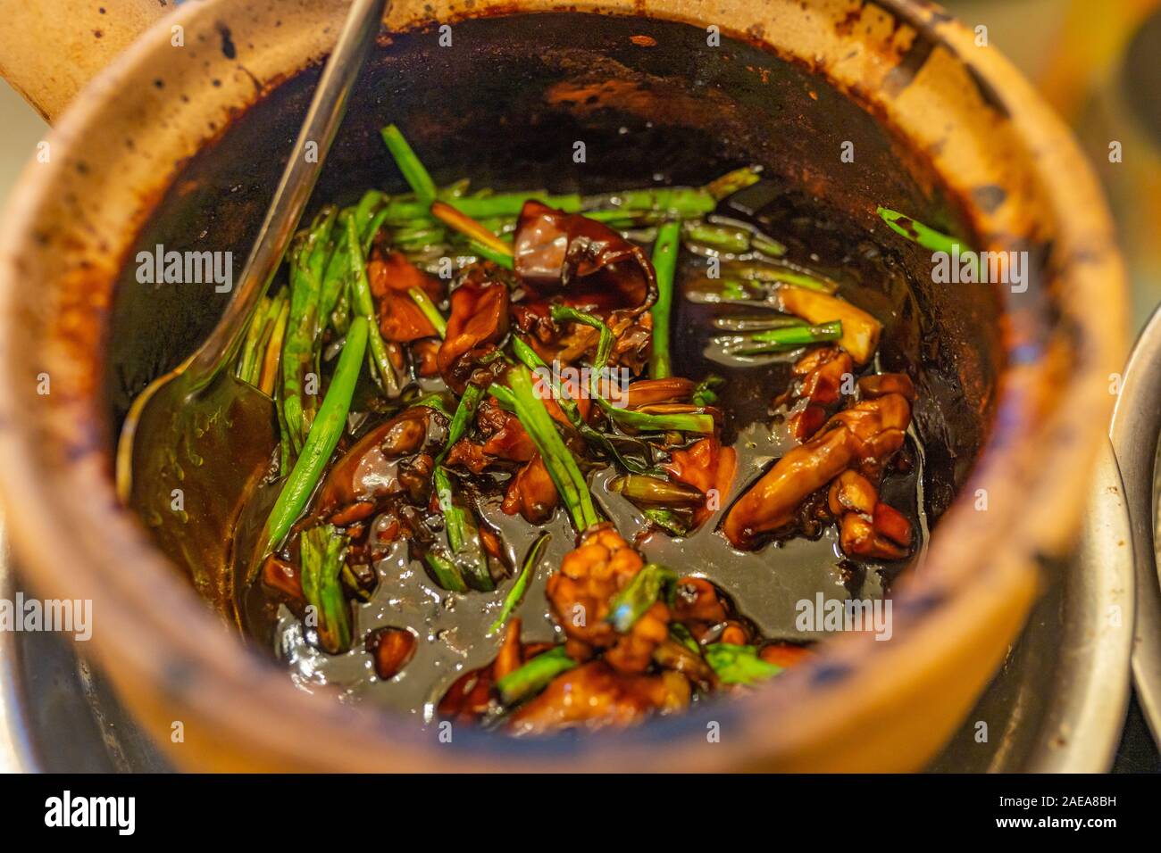 Singapore frog porridge served in clay pot Stock Photo