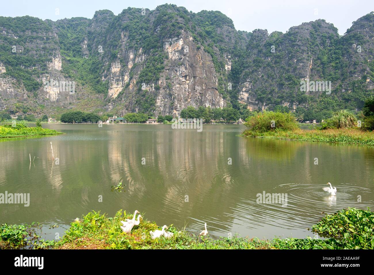 Panoramic view of karst formations in Tam Coc, a part of Trang An Complex , was declared a UNESCO World Heritage Natural and Cultural Monument.Ninh Bi Stock Photo