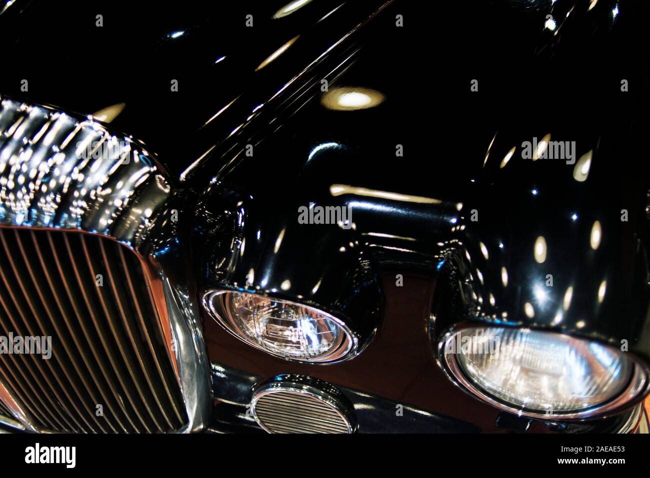 Reflection of spot lights o a classic car hood Stock Photo