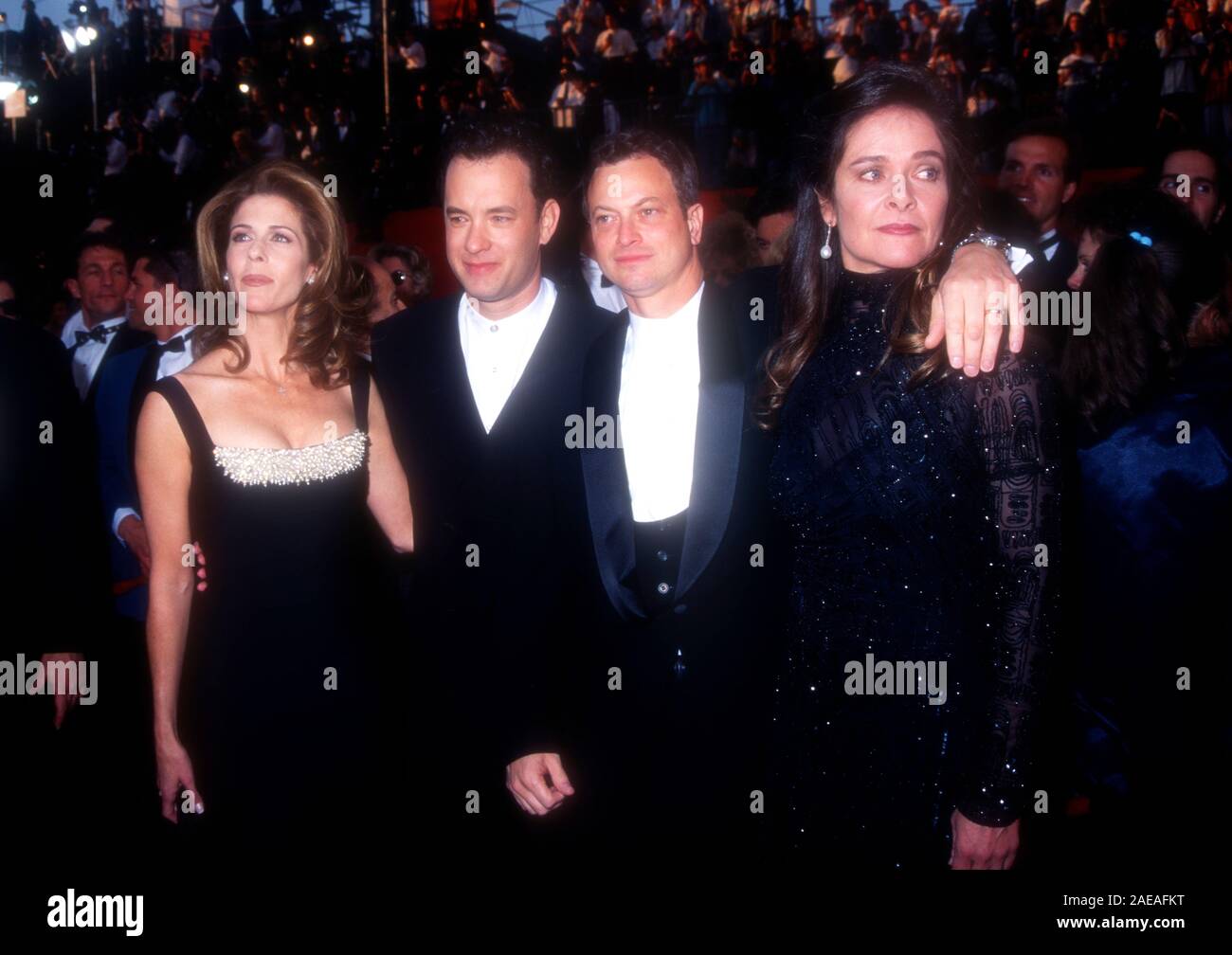 Los Angeles, California, USA 27th March 1995 Singer Rita Wilson, actor Tom Hanks, actor Gary Sinise and wife Moira Harris attend the 67th Annual Academy Awards on March 27, 1995 at the Shrine Auditorium in Los Angeles, California, USA. Photo by Barry King/Alamy Stock Photo Stock Photo
