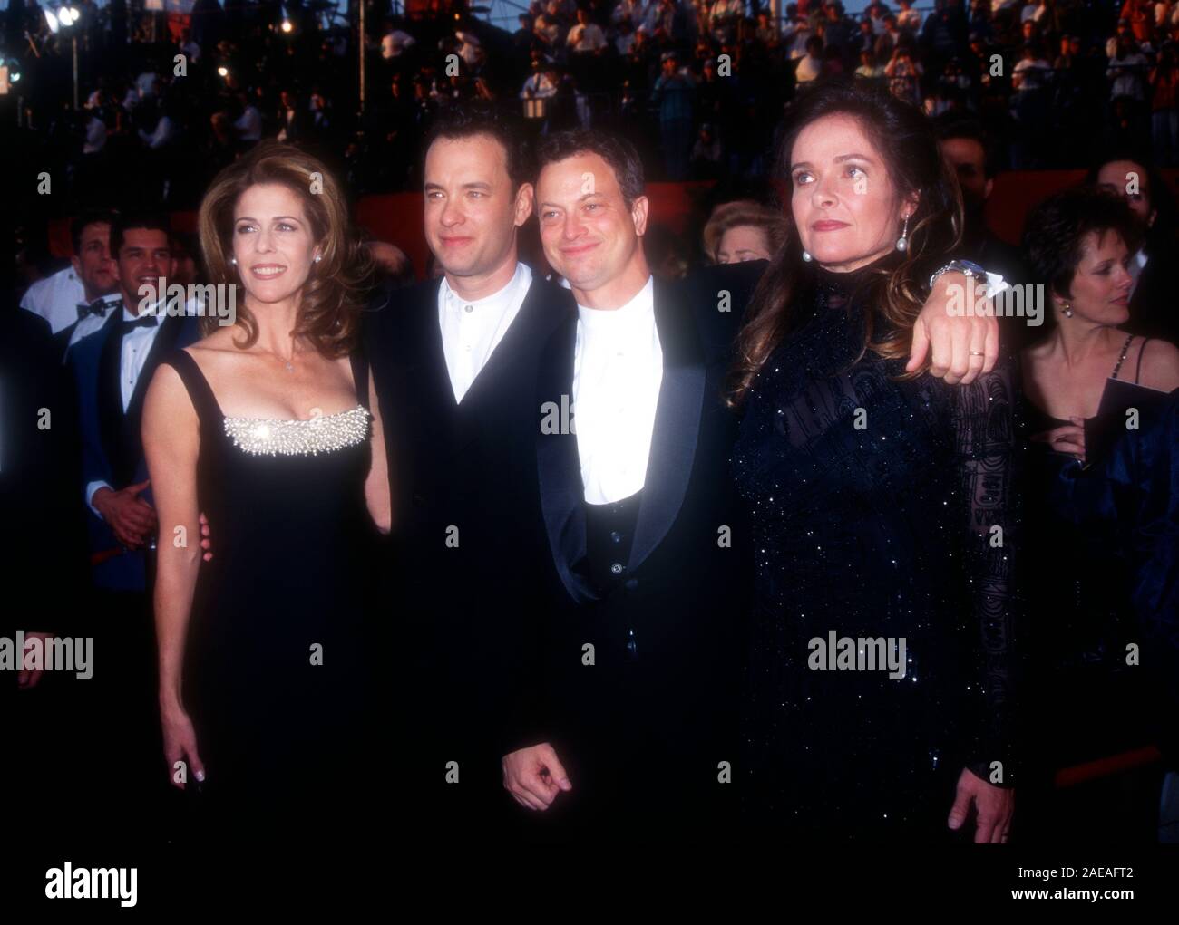 Los Angeles, California, USA 27th March 1995 Singer Rita Wilson, actor Tom Hanks, actor Gary Sinise and wife Moira Harris attend the 67th Annual Academy Awards on March 27, 1995 at the Shrine Auditorium in Los Angeles, California, USA. Photo by Barry King/Alamy Stock Photo Stock Photo