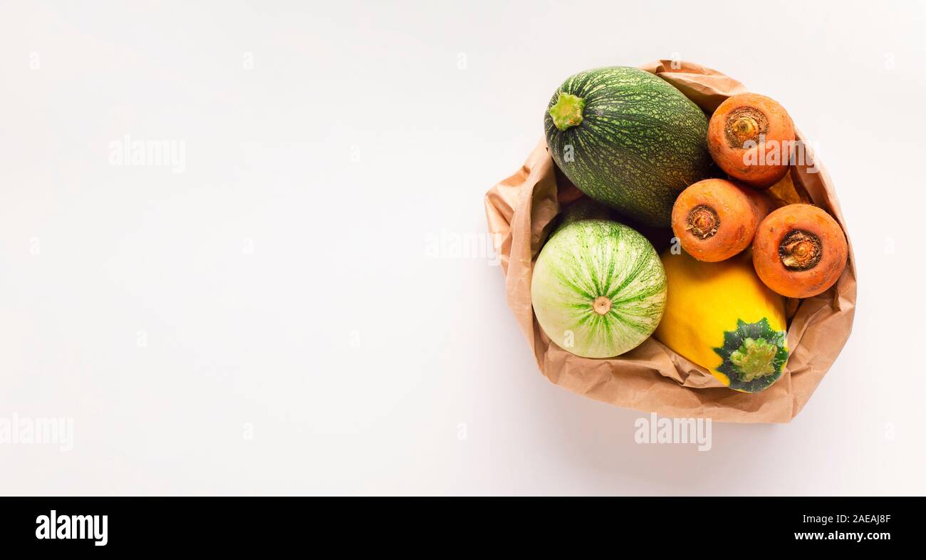 Fresh and tasty zucchini, carrots and squash in zero waste bag Stock Photo