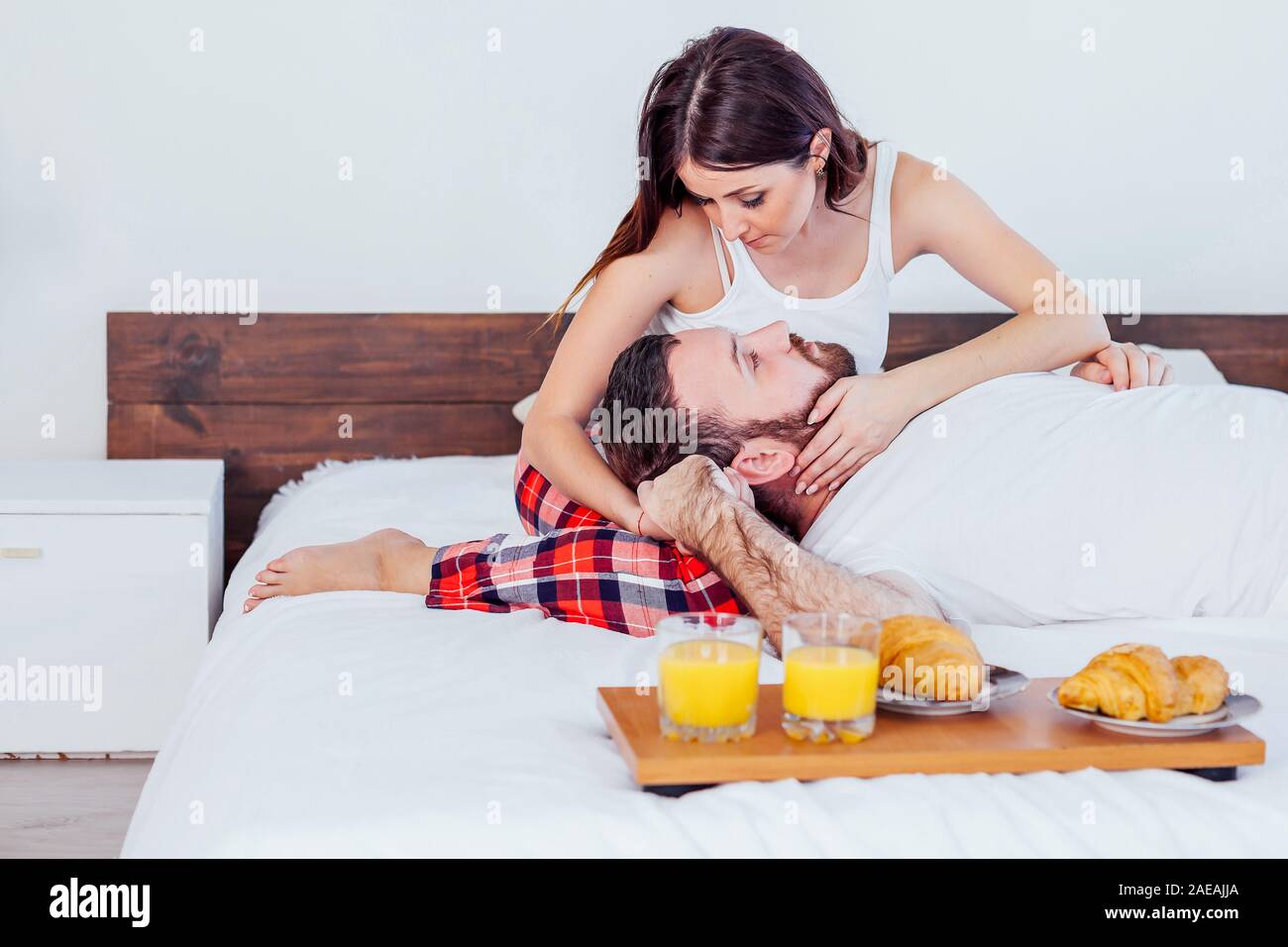 a man with a woman in the morning woke up to breakfast in bed Stock Photo -  Alamy