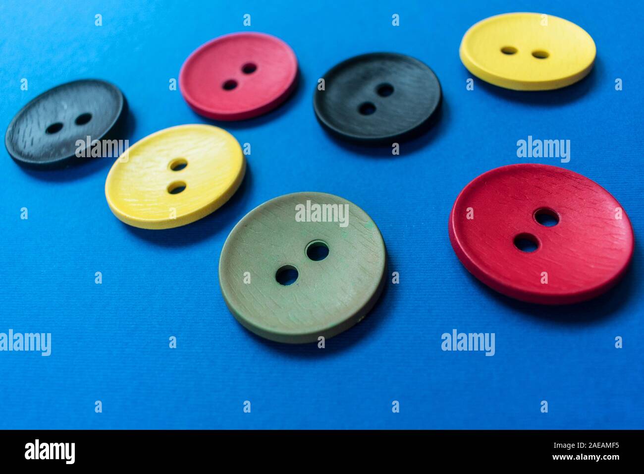 Large multi-colored buttons on a blue background. Stock Photo