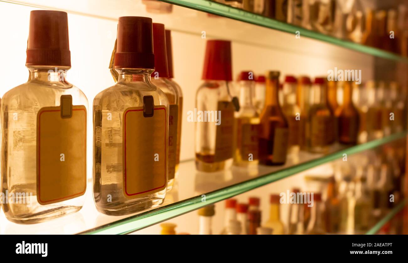 small bottles of grappa on the shelf Stock Photo