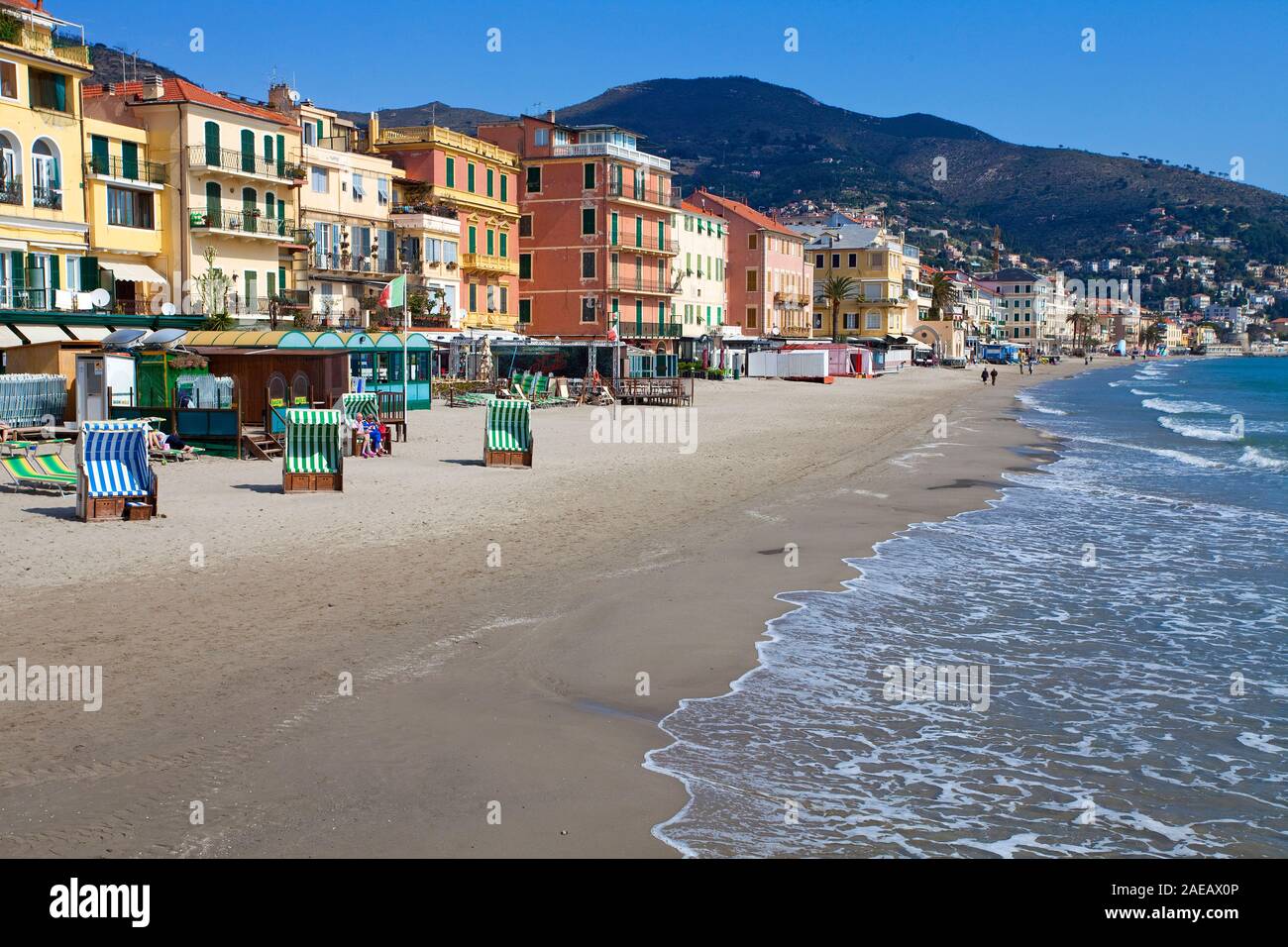 Canopied beach chairs at the bathing beach of Alassio, Riviera di Ponente, Liguria, Italy Stock Photo