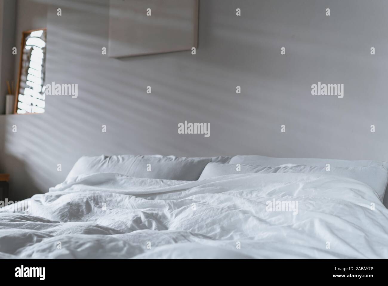 quilt bed white pillows on white bed in bedroom Stock Photo Alamy