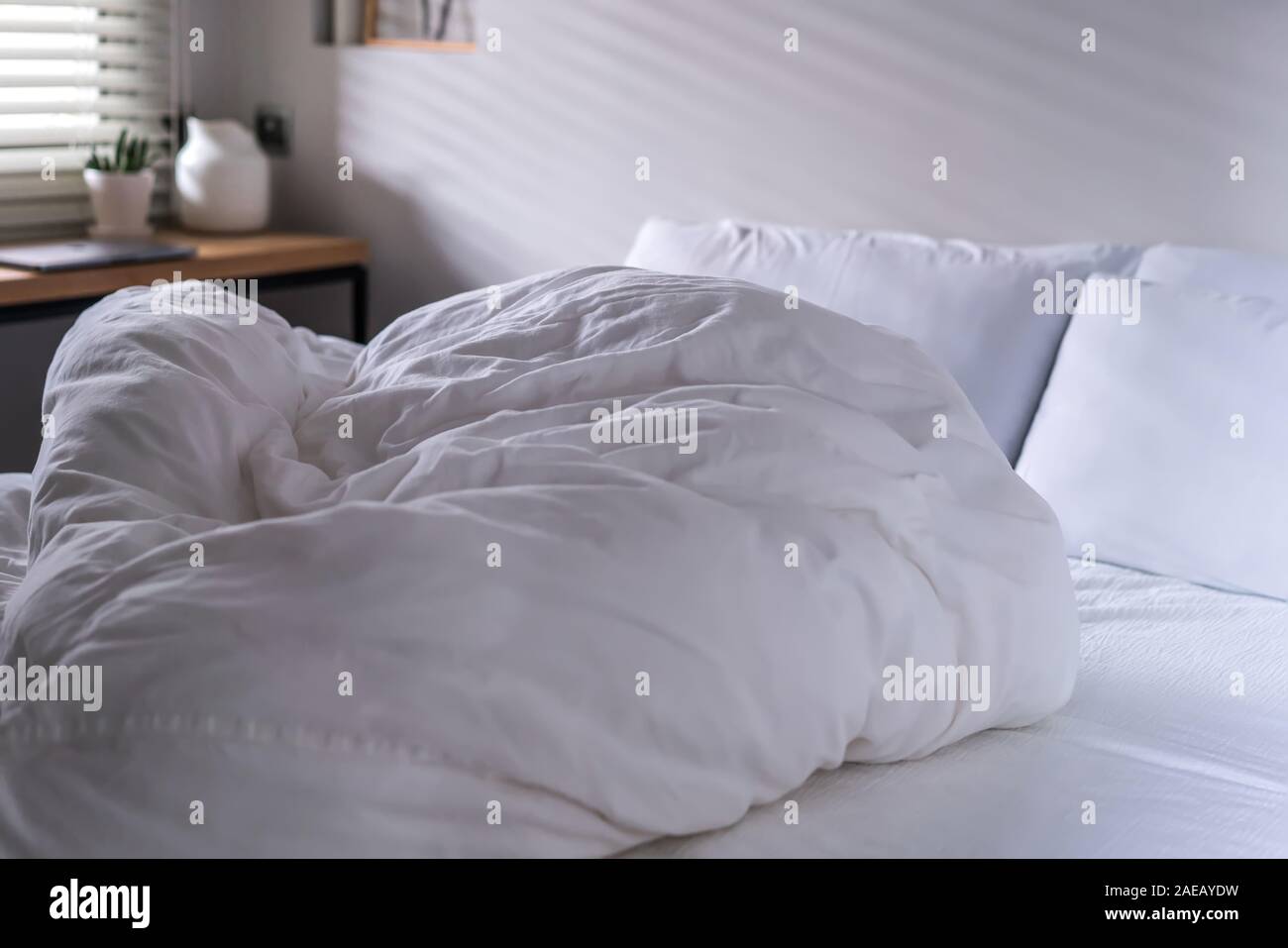quilt bed white pillows on white bed in bedroom Stock Photo Alamy