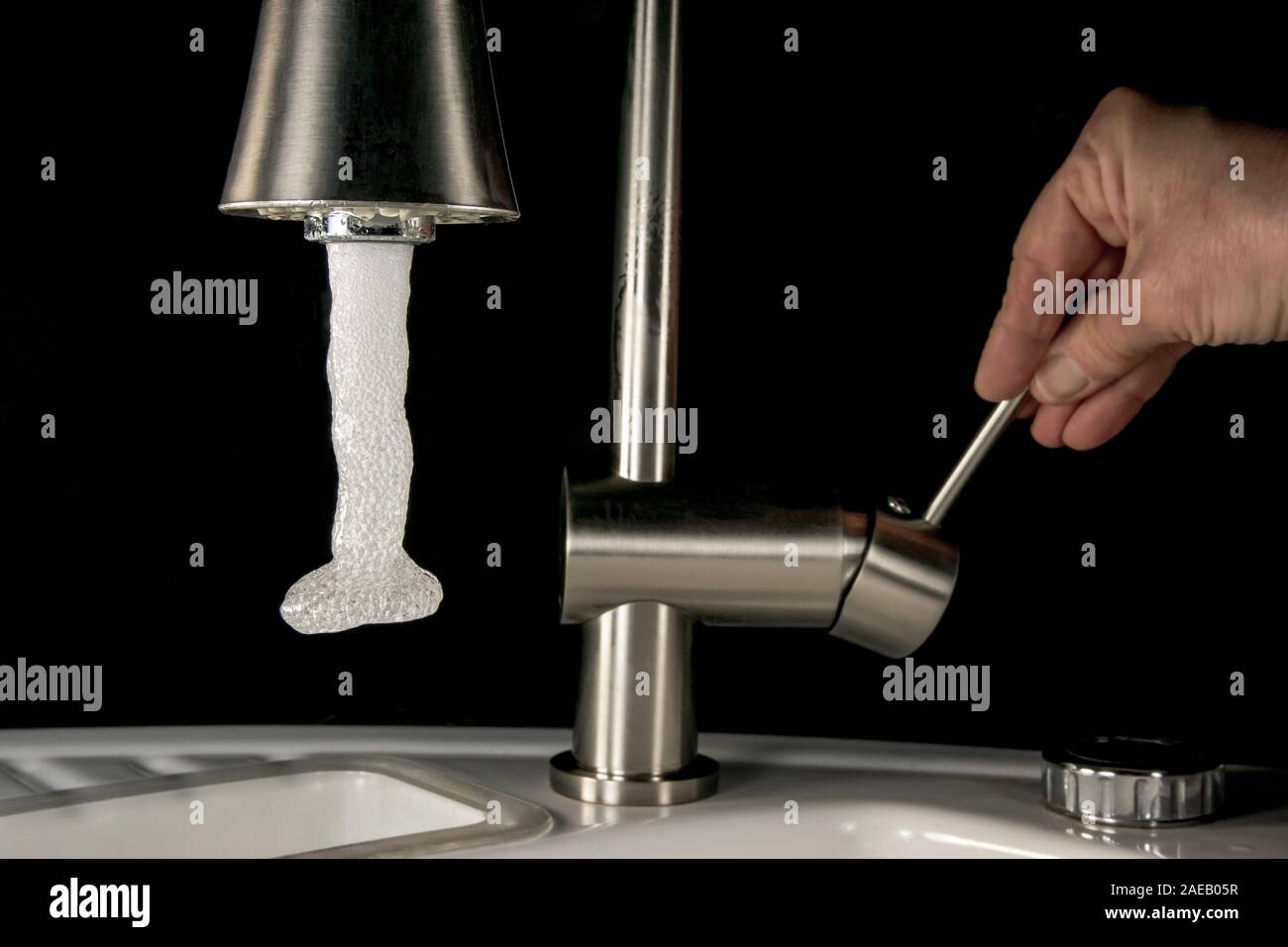 Water Coming Out Of A Faucet High Speed Image Stock Photo