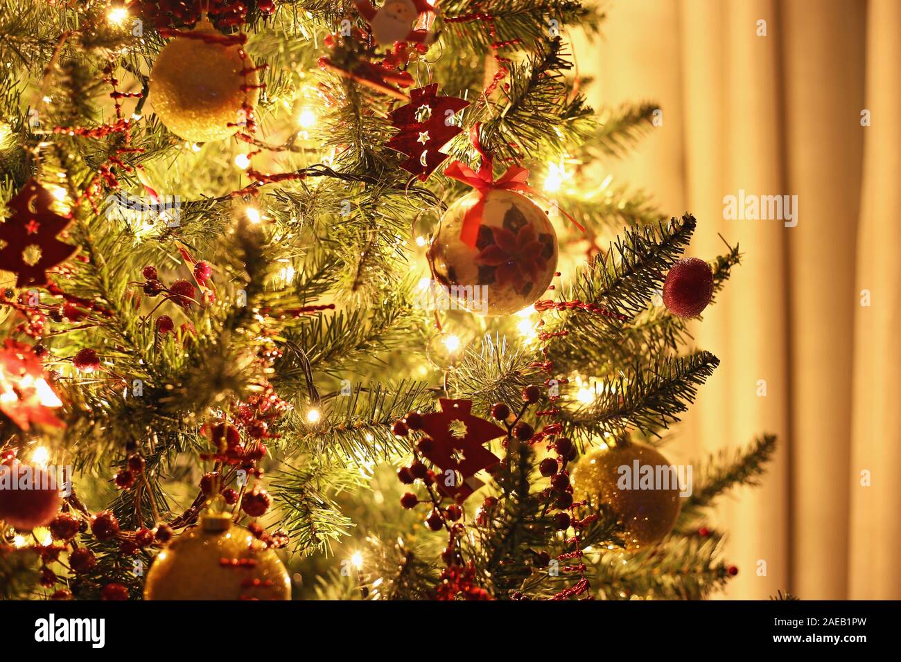 night home scene with Christmas tree and ornaments Stock Photo