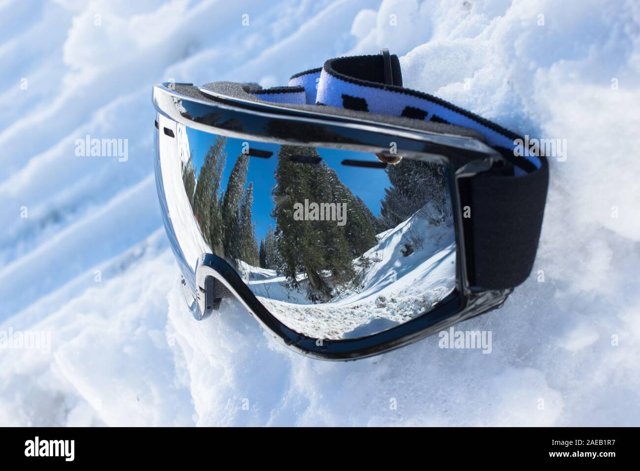 ski glasses in the snow with reflection of landscape Stock Photo
