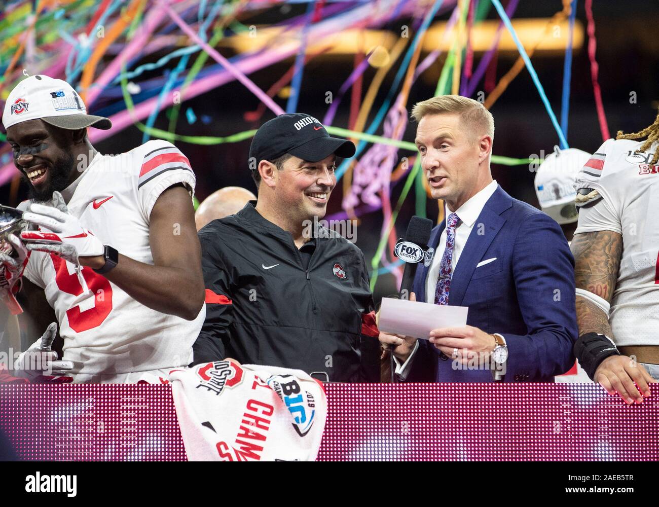 Indianapolis, Indiana, USA. 07th Dec, 2019. Ohio State head coach Ryan Day is all smiles at the trophy presentatiion ceremony after NCAA Football game action between the Ohio State Buckeyes and the Wisconsin Badgers at Lucas Oil Stadium in Indianapolis, Indiana. Ohio State defeated Wisconsin 34-21. John Mersits/CSM/Alamy Live News Stock Photo
