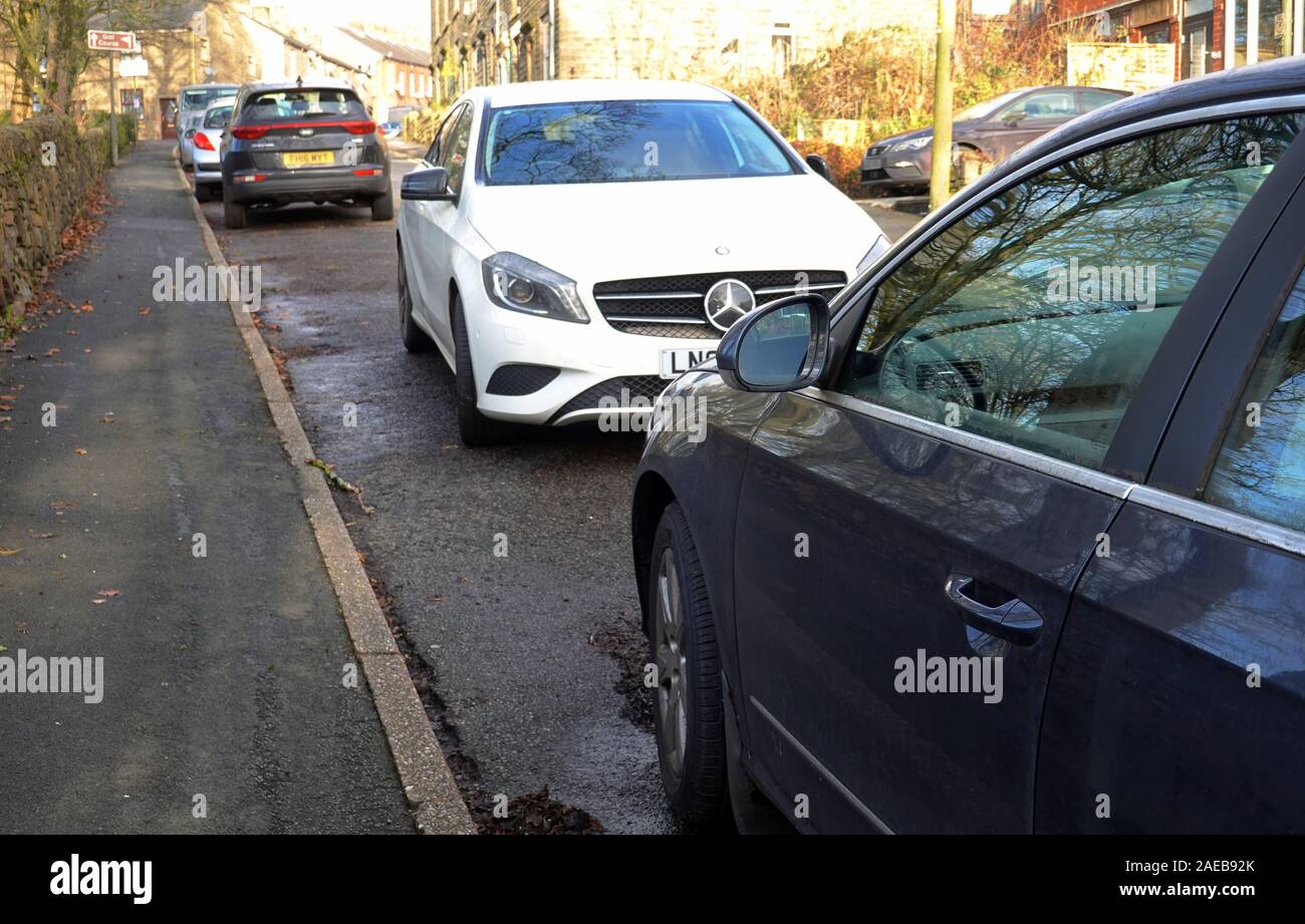 Bad parking on Spring Bank, New Mills, Derbyshire Stock Photo
