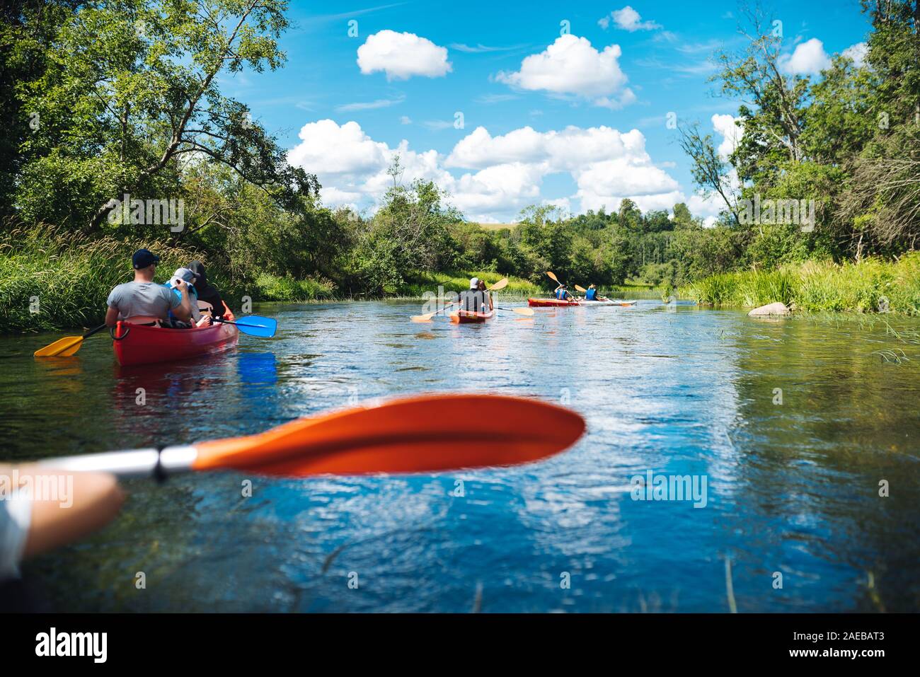 Kayaking with family and friends on river Stock Photo