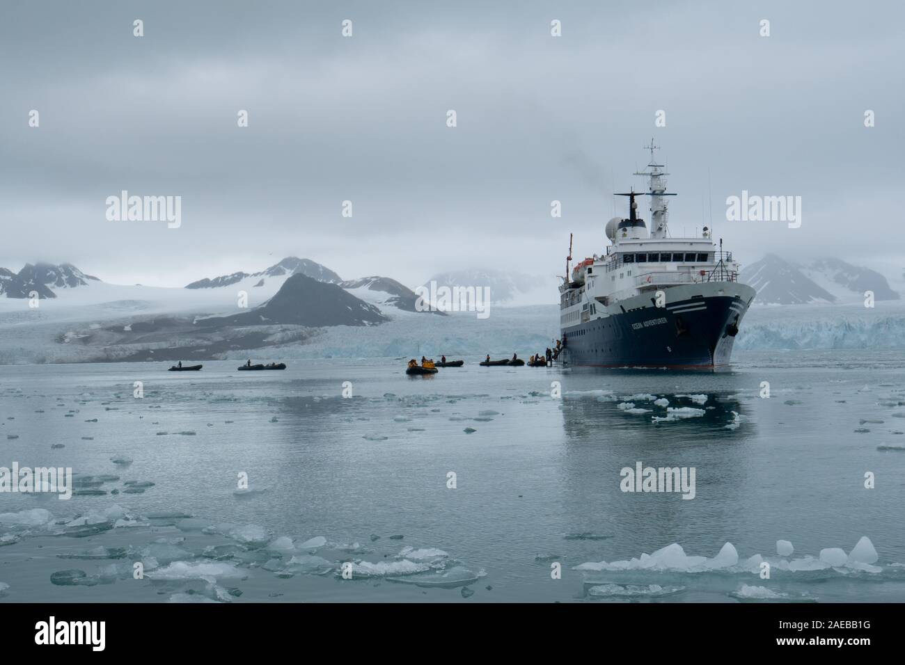 A cruise ship in the Arctic sea ice in Svalbard, Norway in July Stock Photo