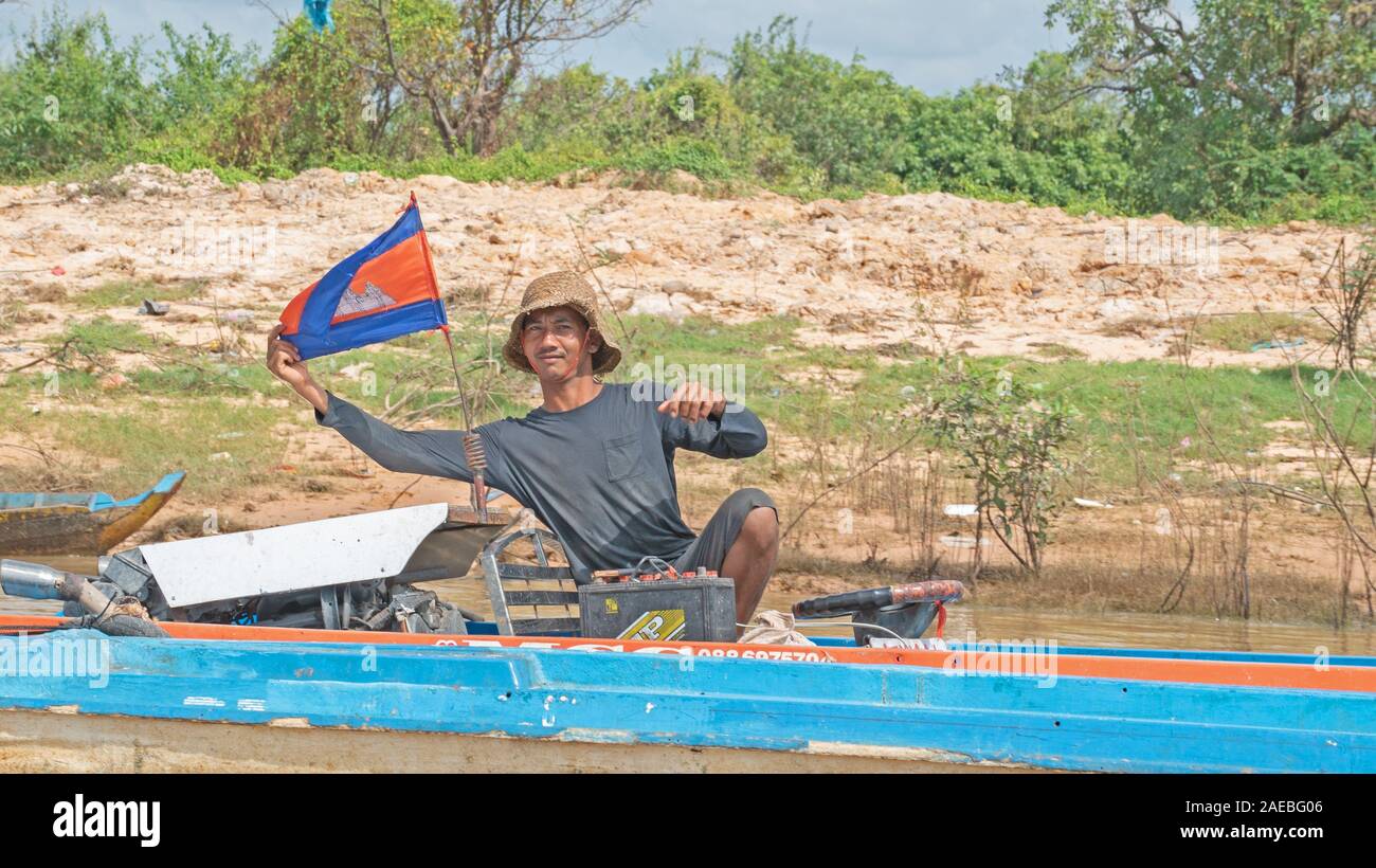Man on a boat on mekong river Stock Photo