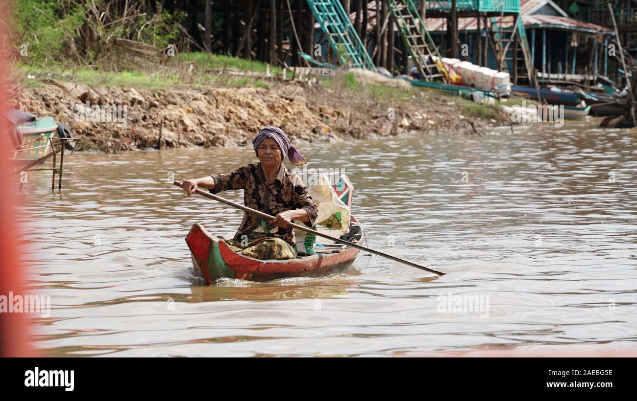 Man on a boat on mekong river Stock Photo