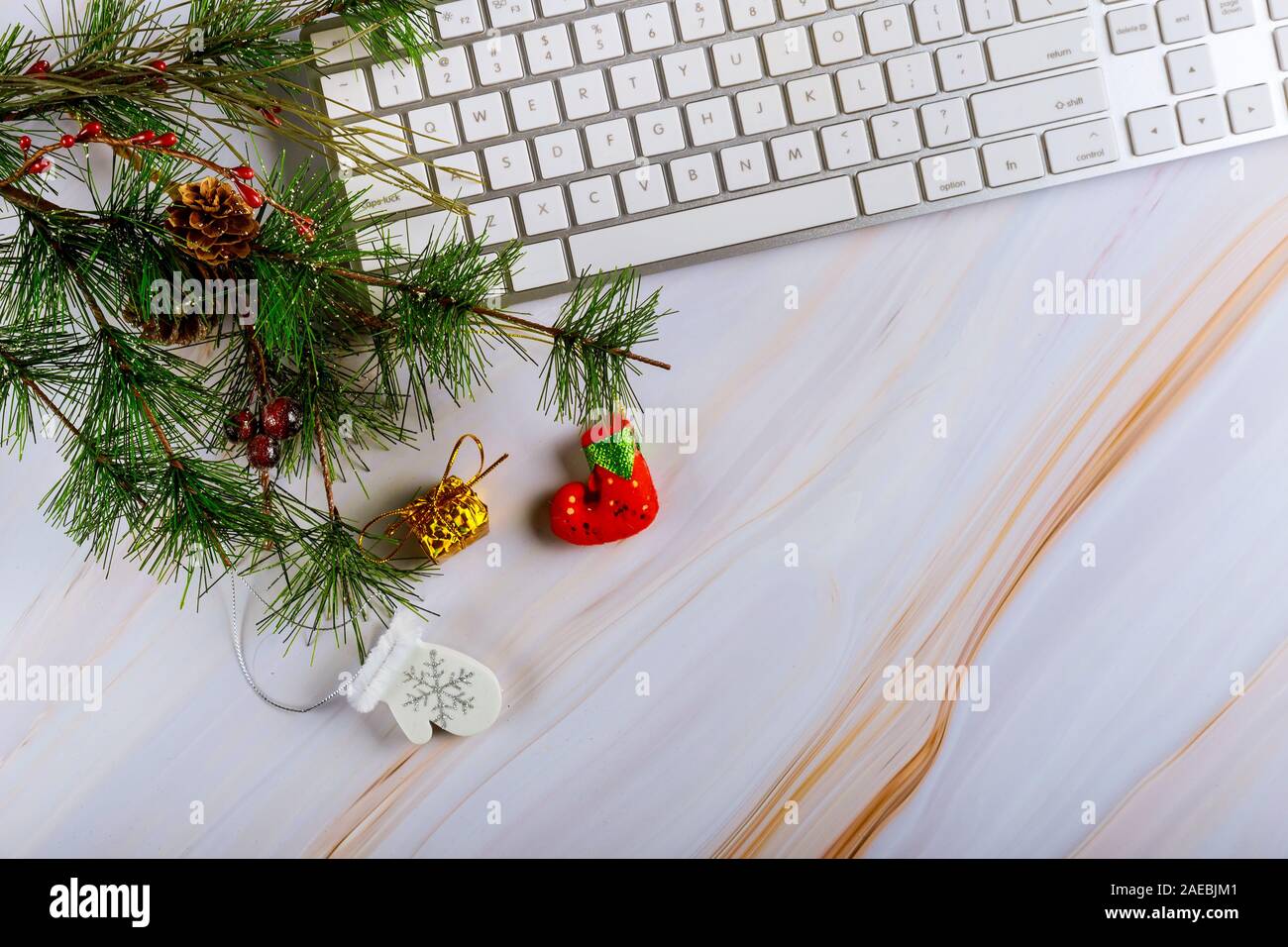 Christmas composition with computer keyboard with ornaments on the Christmas tree Stock Photo