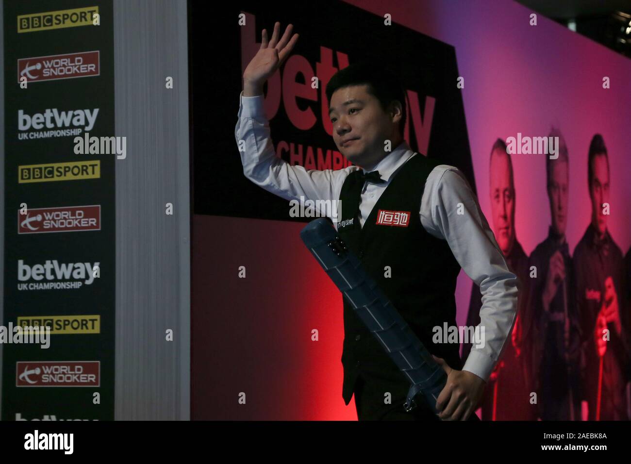 Ding Junhui enters the arena ahead of the final on day twelve of the Betway UK Championship at the York Barbican. Stock Photo