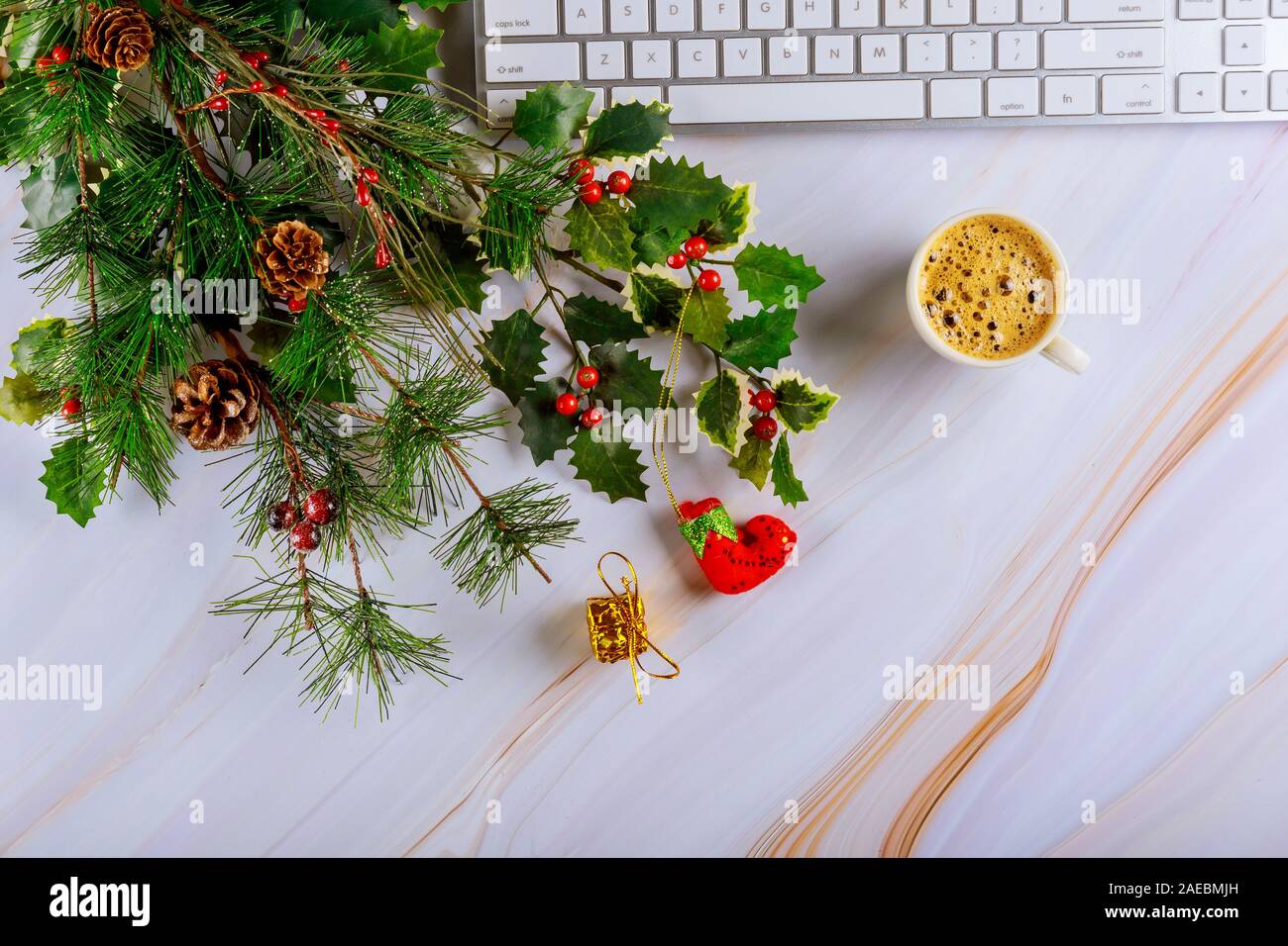 Christmas decoration tree with shiny office table with computer