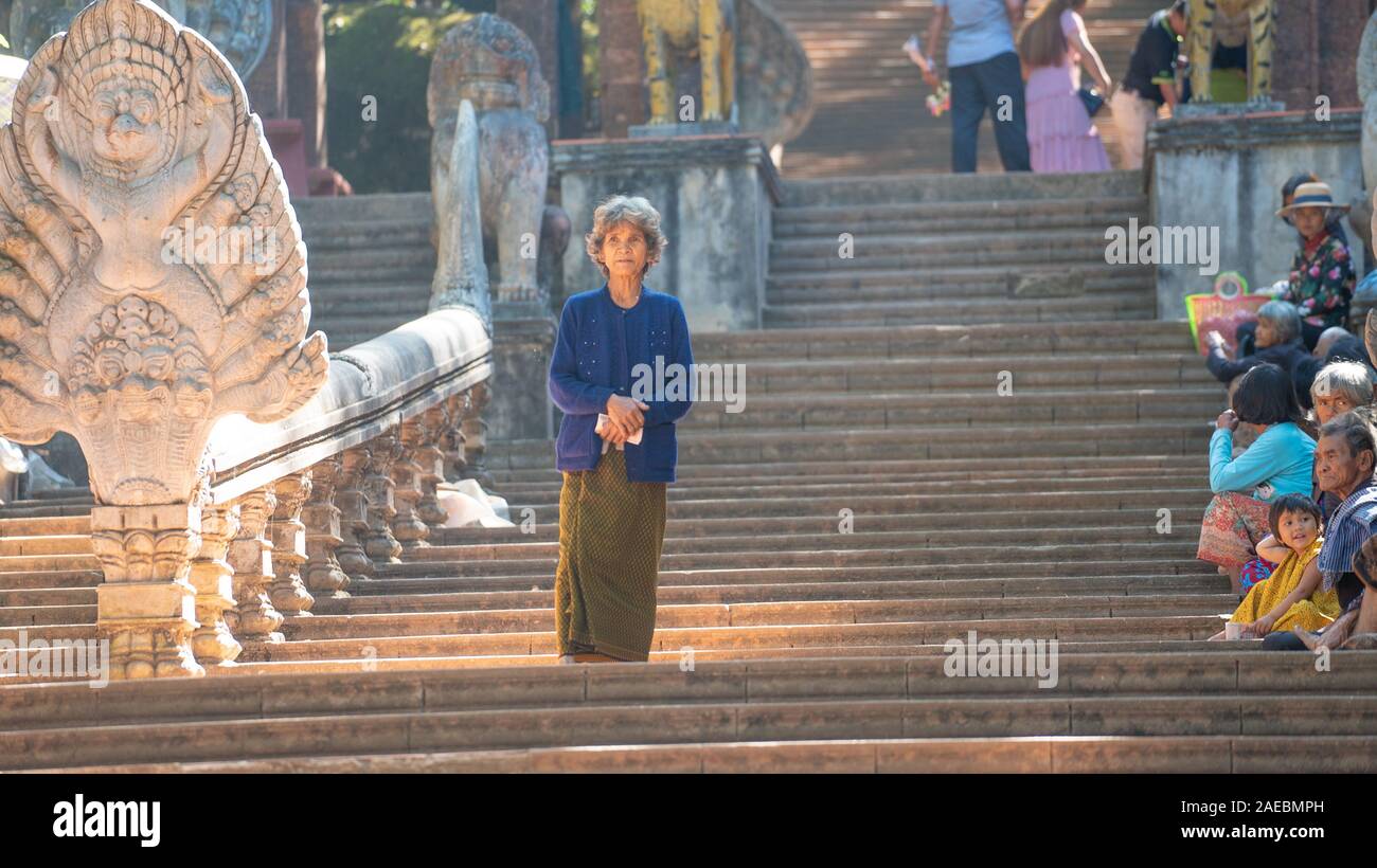 Women onthe stairs of wat phnom Stock Photo