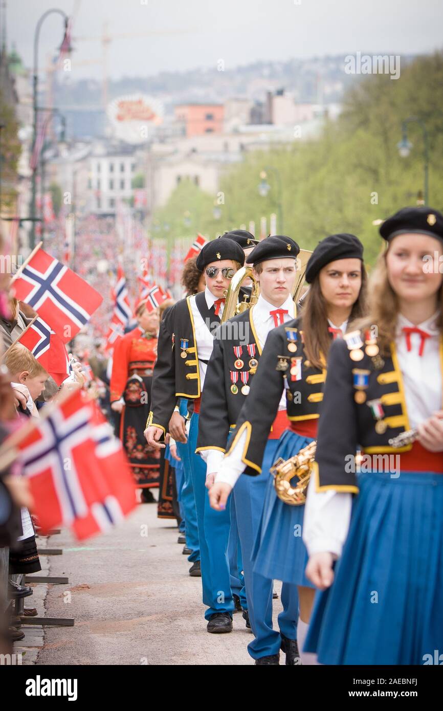 Oslo, Norway - May 17, 2010: National day in Norway. Norwegians at traditional celebration and parade on Karl Johans Gate street. Stock Photo