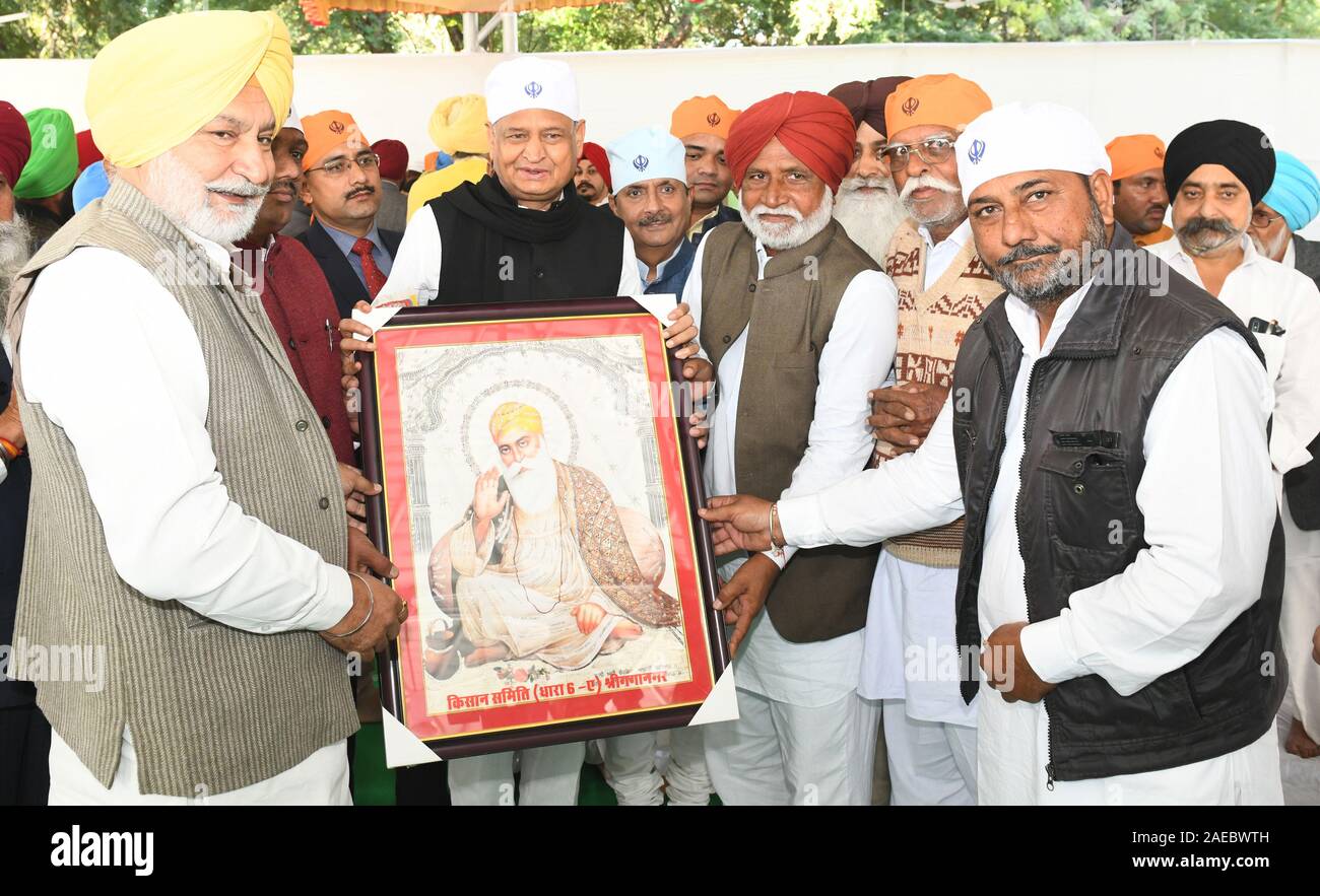 Sikh community presents an picture to Rajasthan CM Ashok Gehlot during the Shabad Kirtan on the occasion of 550th Anniversary of Guru Nanak Dev ji. Stock Photo