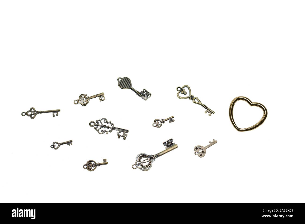 Vintage skeleton keys with metall heart on white background Stock Photo ...