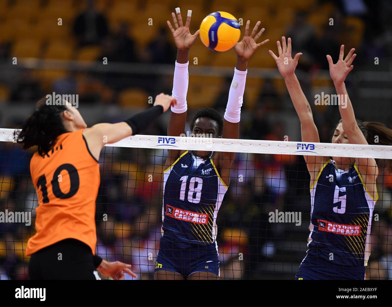 Shaoxing, China. 8th Dec, 2019. Paola Ogechi Egonu (C) and Robin De Kruijf (R) of Imoco Volley Conegliano block during the final match between Imoco Volley Conegliano of Italy and Eczaclbasl Vitra Istanbul of Turkey at 2019 FIVB Women's Club World Championship in Shaoxing, east China, on Dec. 8, 2019. Credit: Li Jundong/Xinhua/Alamy Live News Stock Photo