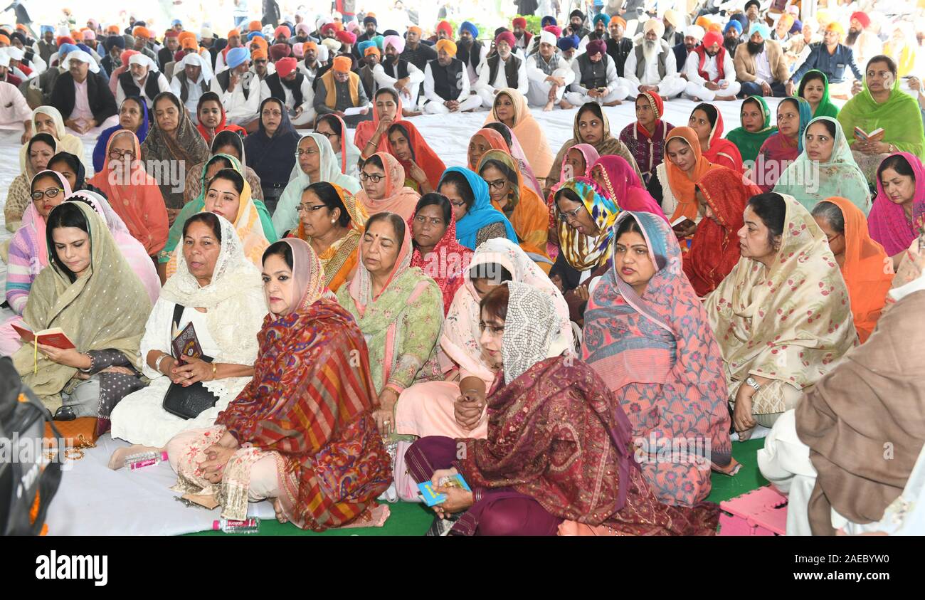 Sikh community take part in the Shabad Kirtan held on the occasion of 550th Anniversary of Shri Guru Nanak Dev ji at Jaipur. Stock Photo