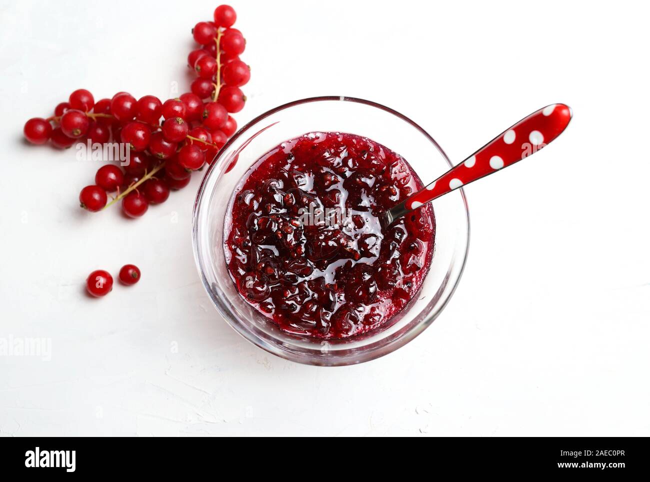 Homemade jam. Top view of red currant jam in a glass bowl and fresh currant  on white background Stock Photo - Alamy