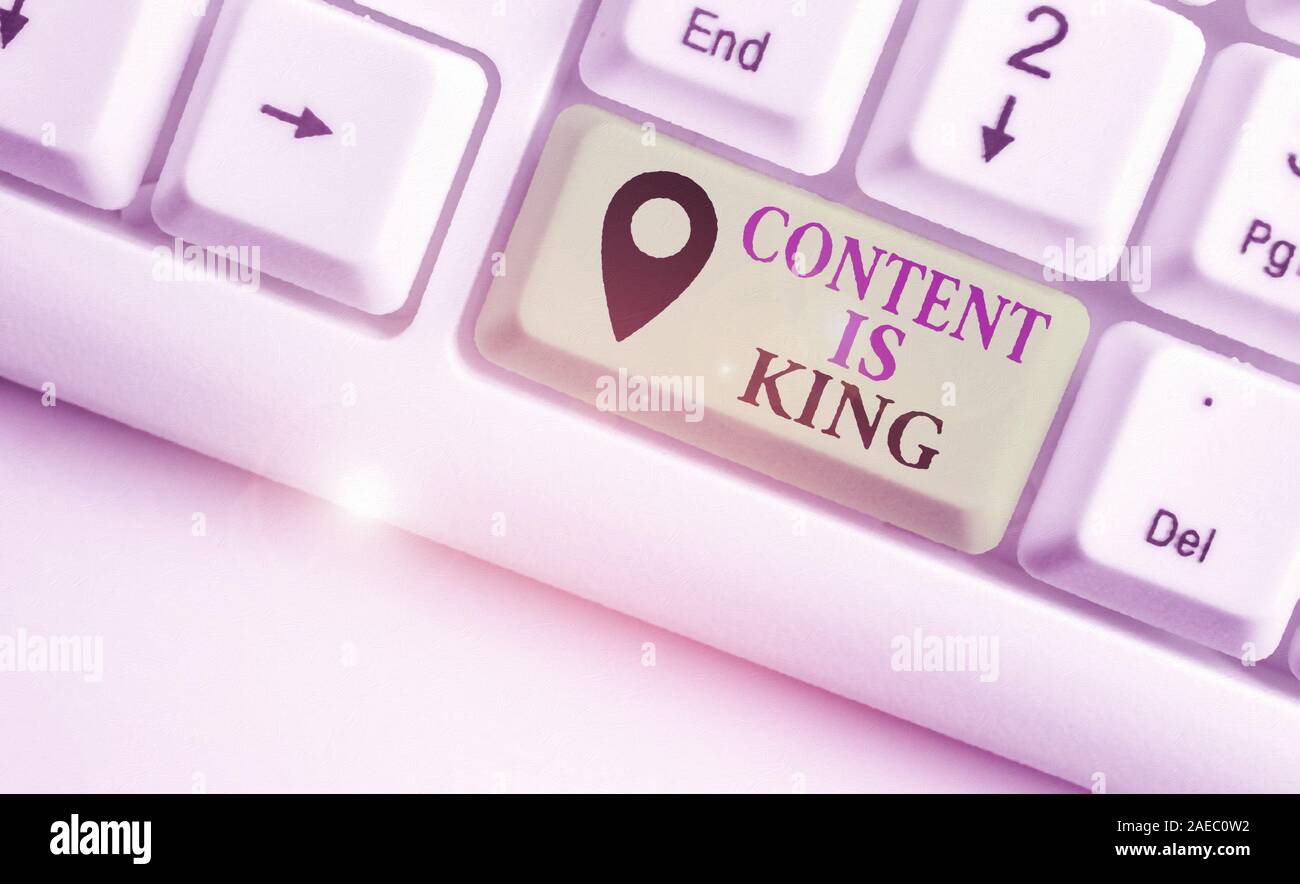 Writing note showing Content Is King. Business concept for Content is the heart of todays marketing strategies Stock Photo