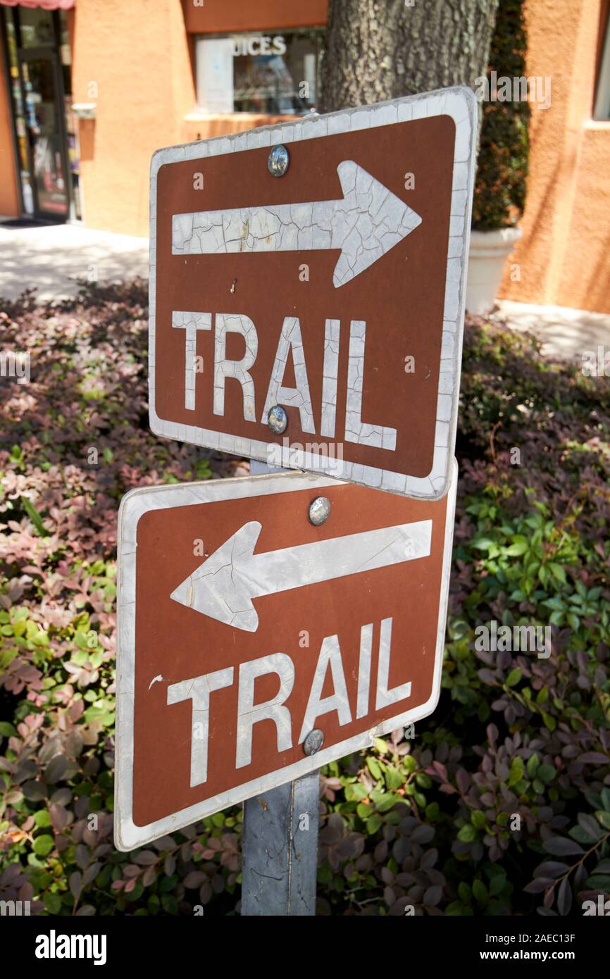 brown trail arrows direction signs for the west orange trail in winter garden florida usa Stock Photo